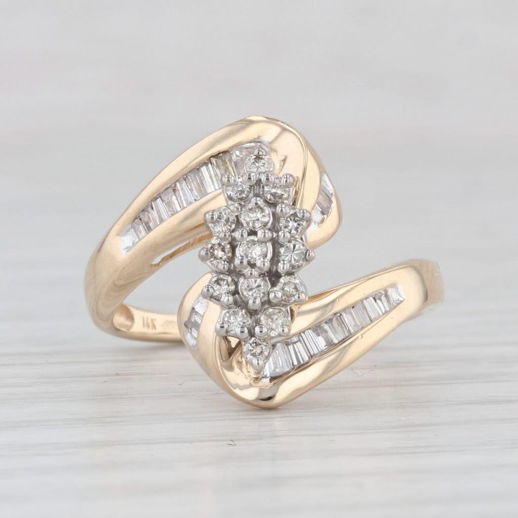 Gemstone Information:
- Natural Diamonds -
Total Carats - 0.35ctw
Cut - Round Brilliant & Baguette
Color - I - K
Clarity - SI2 - I1

Metal: 14k Yellow Gold
Weight: 4.7 Grams 
Stamps: 14k
Face Height: 16.1 mm 
Rise Above Finger: 9.2 mm
Band / Shank