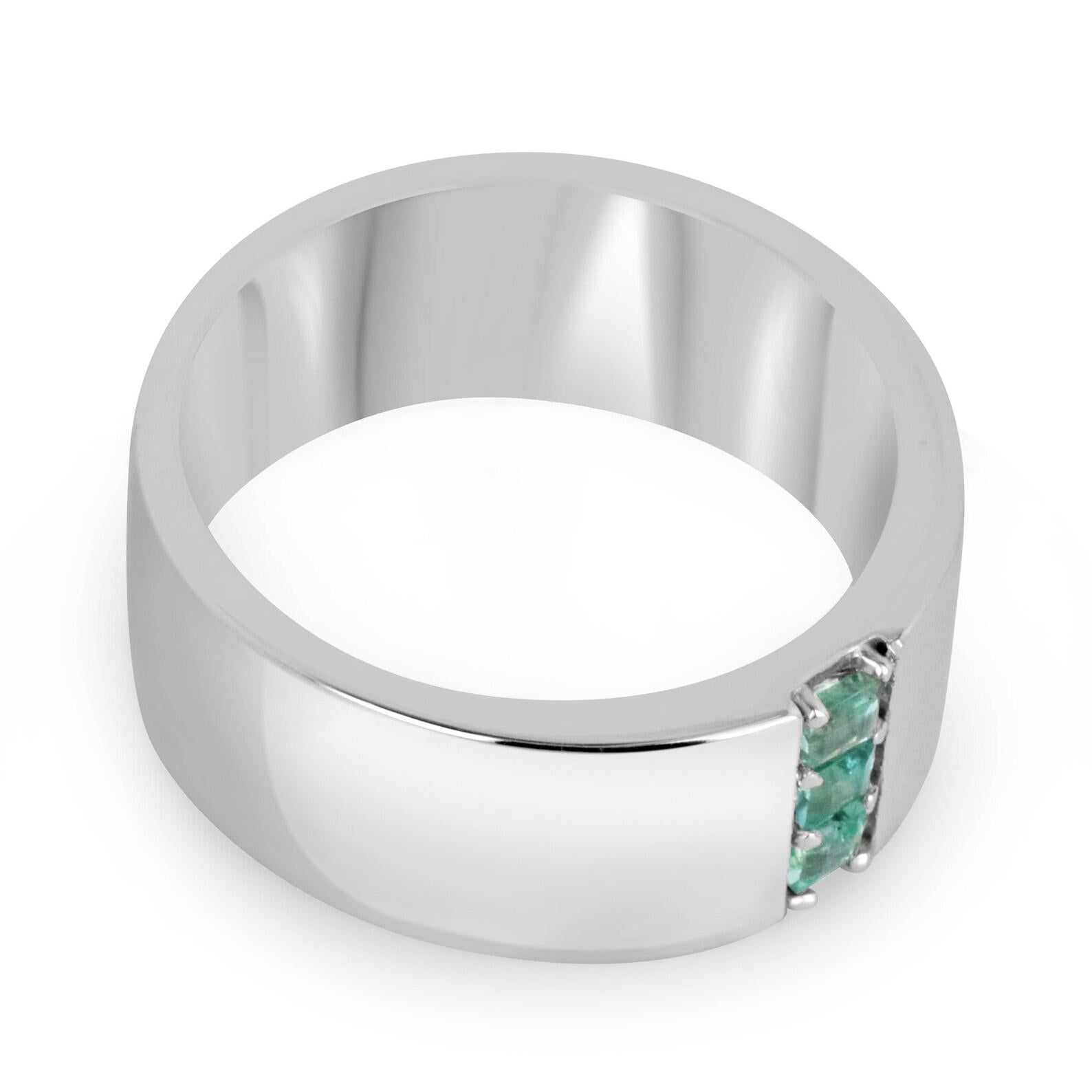 A dapper natural emerald men's ring that features three petite Asscher cut emeralds in the very center; creating a unique three-stone look that showcases vertically. Ideal for everyday use, and crafted in shiny sterling silver.

Setting Style: