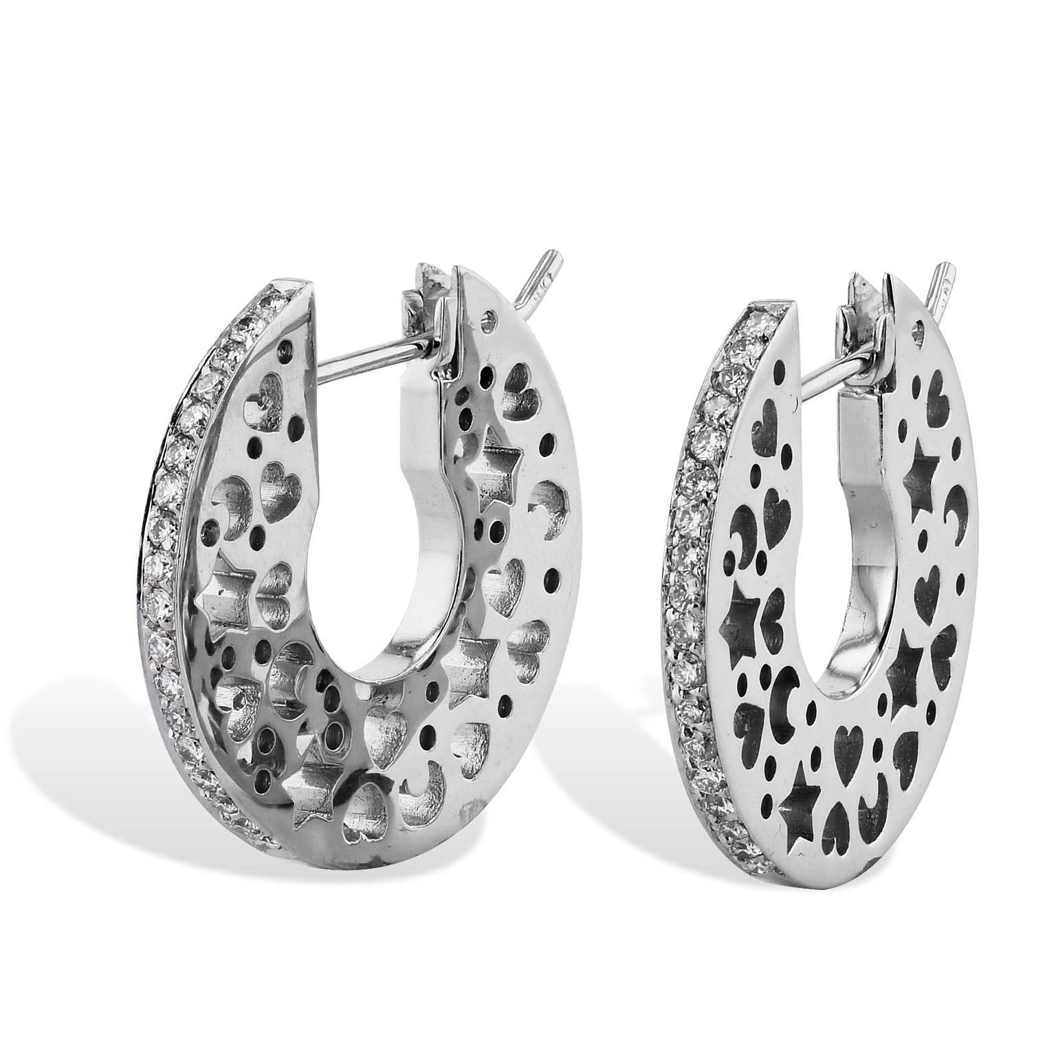 These previously loved Italian hoops are fashioned in 18 karat white gold and feature 0.36 carat of pave-set diamond (F/G/SI1). Embellished by punch-out designs of hearts, stars, and moons; these hoop earrings are charming and fun.