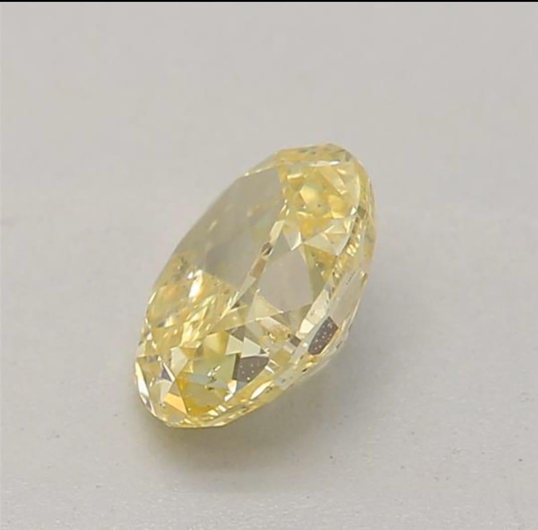 Oval Cut 0.36 carat Fancy Intense Yellow Oval shaped diamond I2 clarity GIA certified For Sale