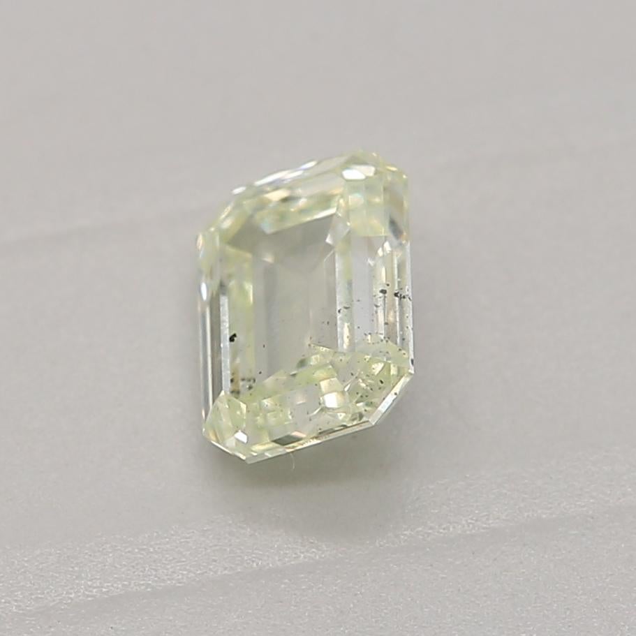 Emerald Cut 0.36 Carat Light Yellow Green Emerald cut diamond SI1 Clarity GIA Certified For Sale