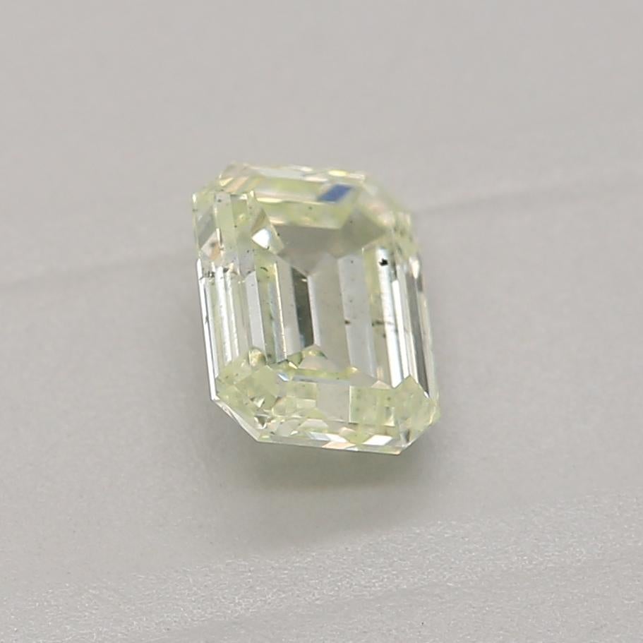 Women's or Men's 0.36 Carat Light Yellow Green Emerald cut diamond SI1 Clarity GIA Certified For Sale
