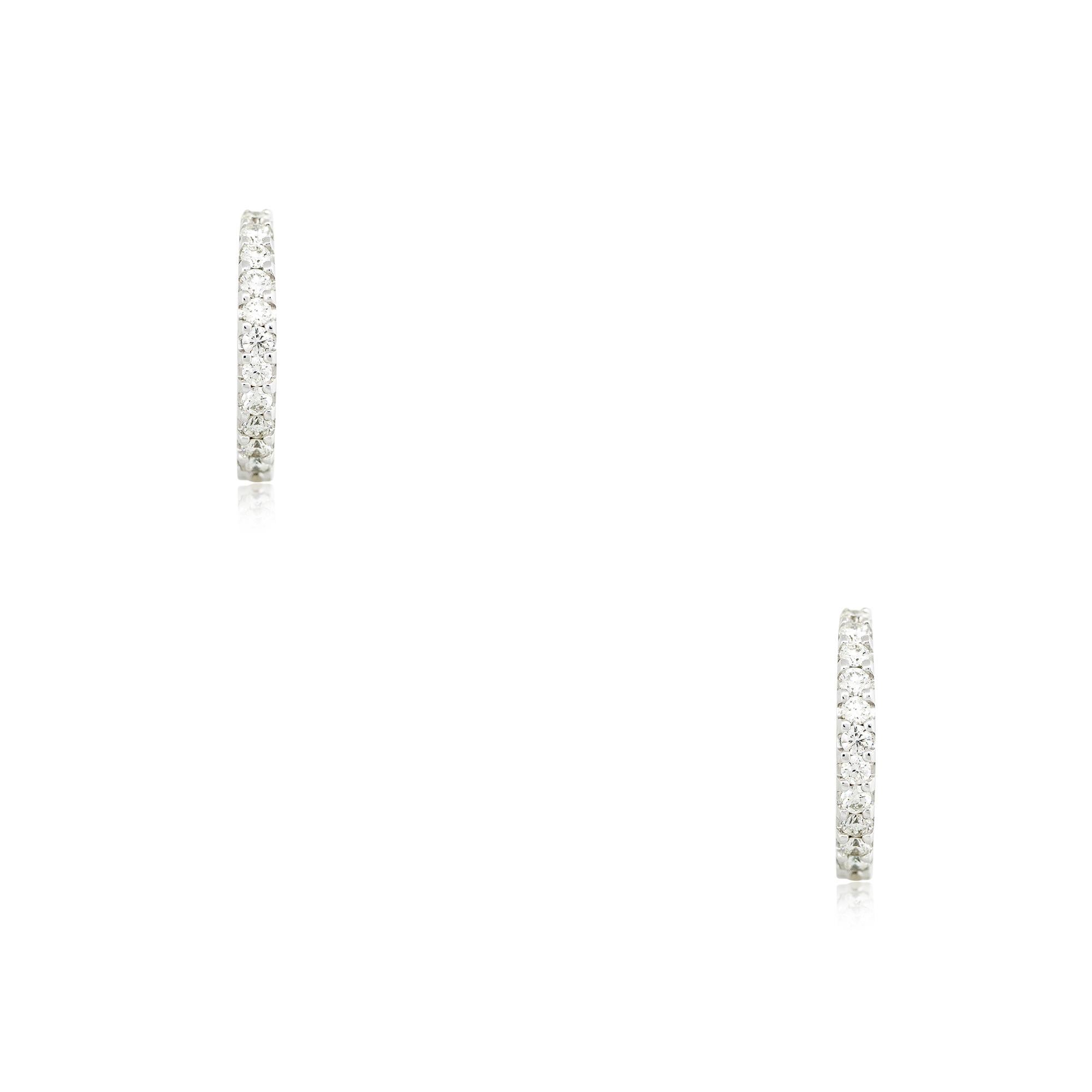 14k White Gold 0.36ctw Small Round Brilliant Diamond Hoop Earrings
Material: 14k White Gold
Diamond Details: Diamonds are approximately 0.36ctw of Round Brilliant cut Diamonds. There are 11 stones in each earring. Diamonds are approximately G/H in