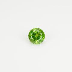 0.36 ct, Faceted Russian demantoid garnet with horsetail inclusion