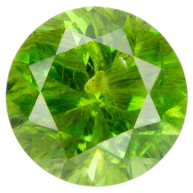 0.36 ct, Faceted Russian demantoid garnet with horsetail inclusion For Sale