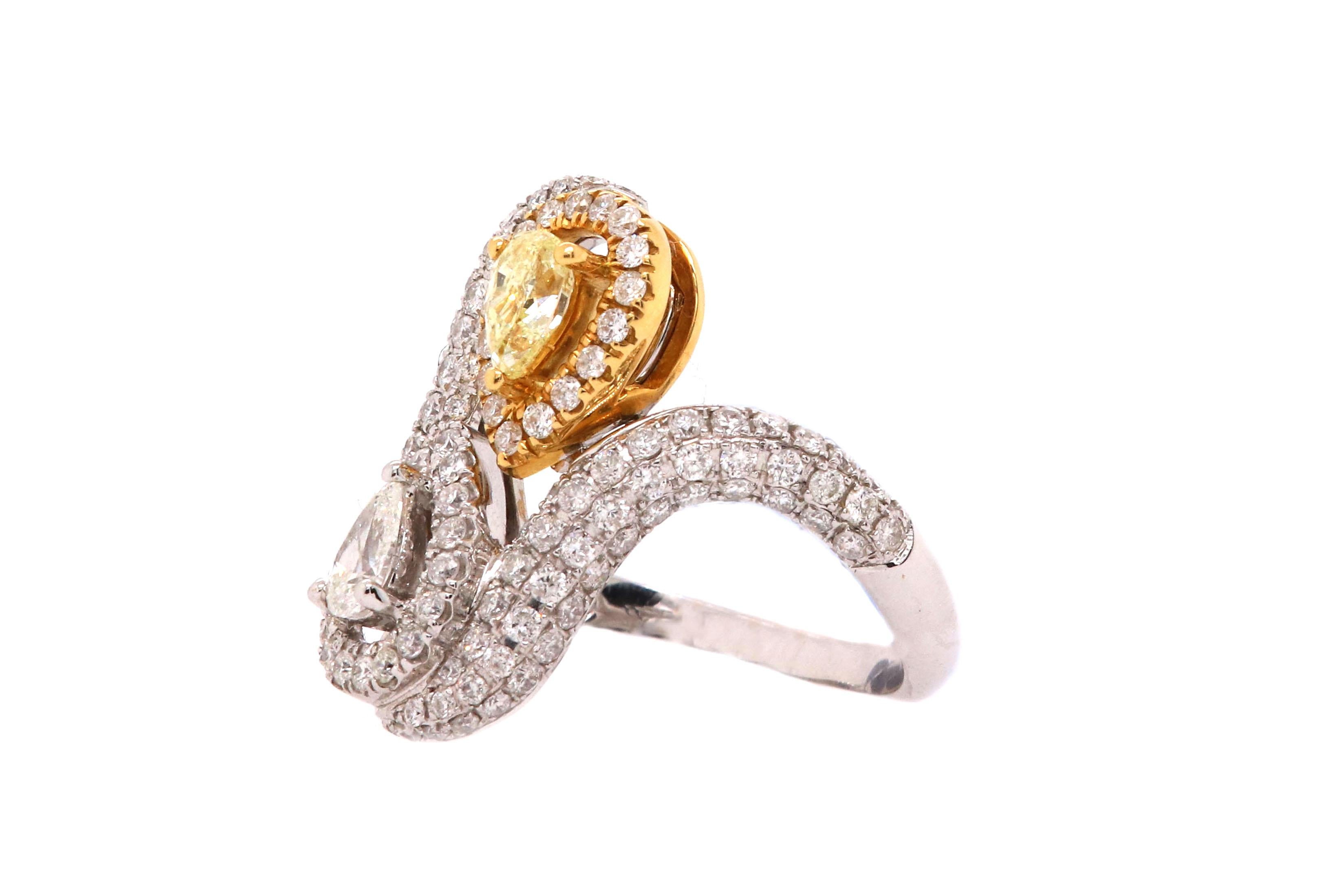 Material: 18k Two Tone Gold
Center Stone Details:  1 Pear Shaped Yellow Diamond at 0.36 Carats
Mounting Diamond Details: 1 Pear Shaped White Diamond at 0.22 Carats
Diamond Details: 130 Brilliant Round White Diamonds as 1.03 carats SI Clarity/H-I