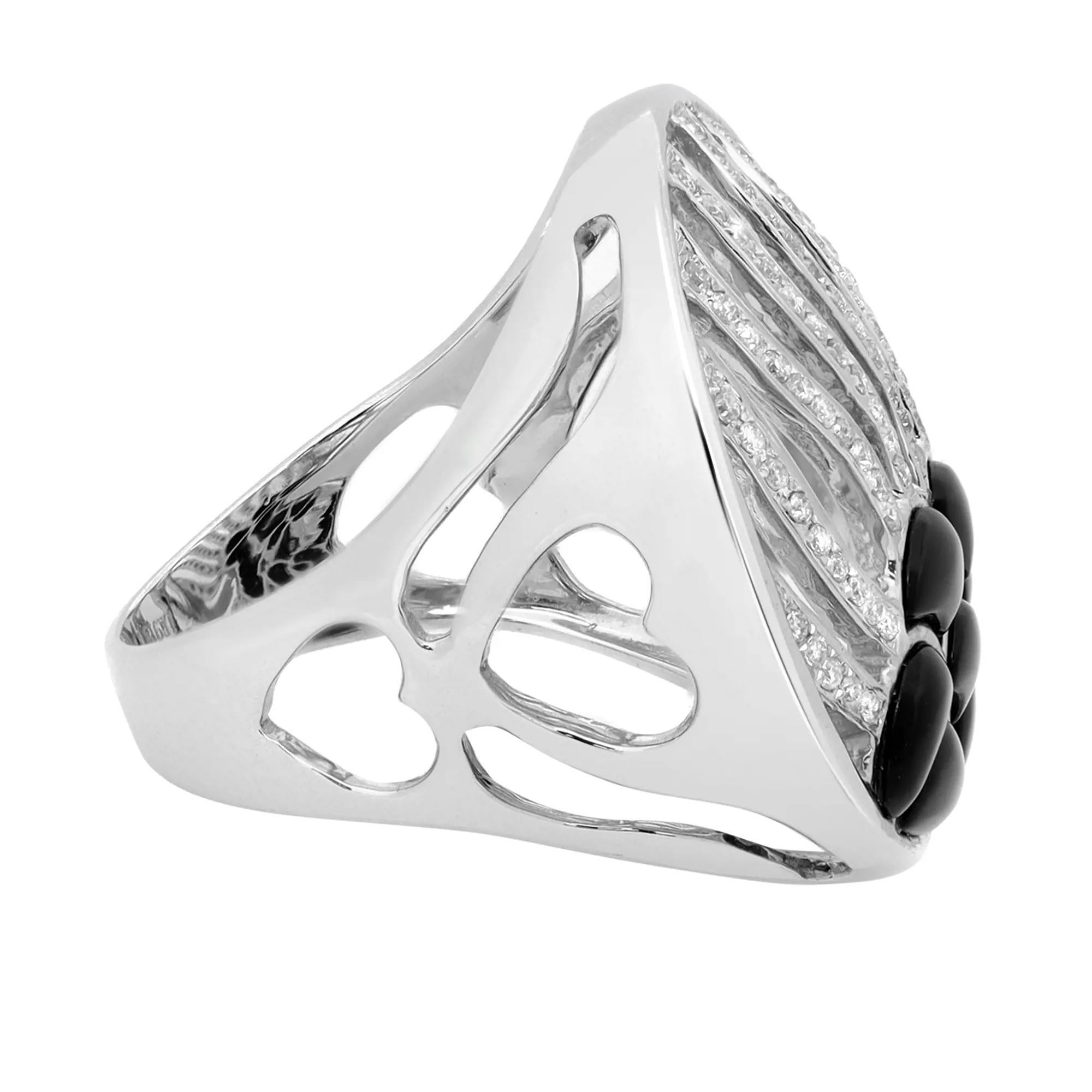 This bold and beautiful ring features pave set round cut diamonds set in a wave pattern with black onyx. Total diamond weight: 0.36 carat. Diamond color I and SI1 clarity. Crafted in brightly polished 14k white gold. The ring size is 7.5 and the