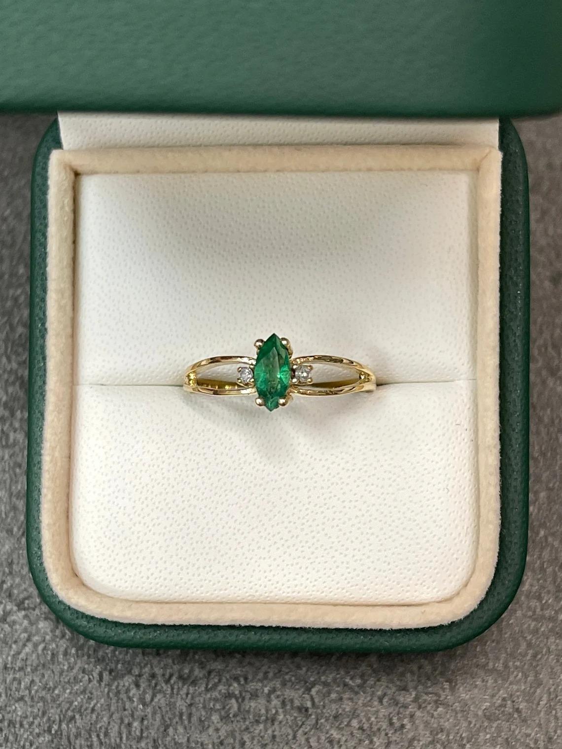 marquise cut emerald and diamond ring