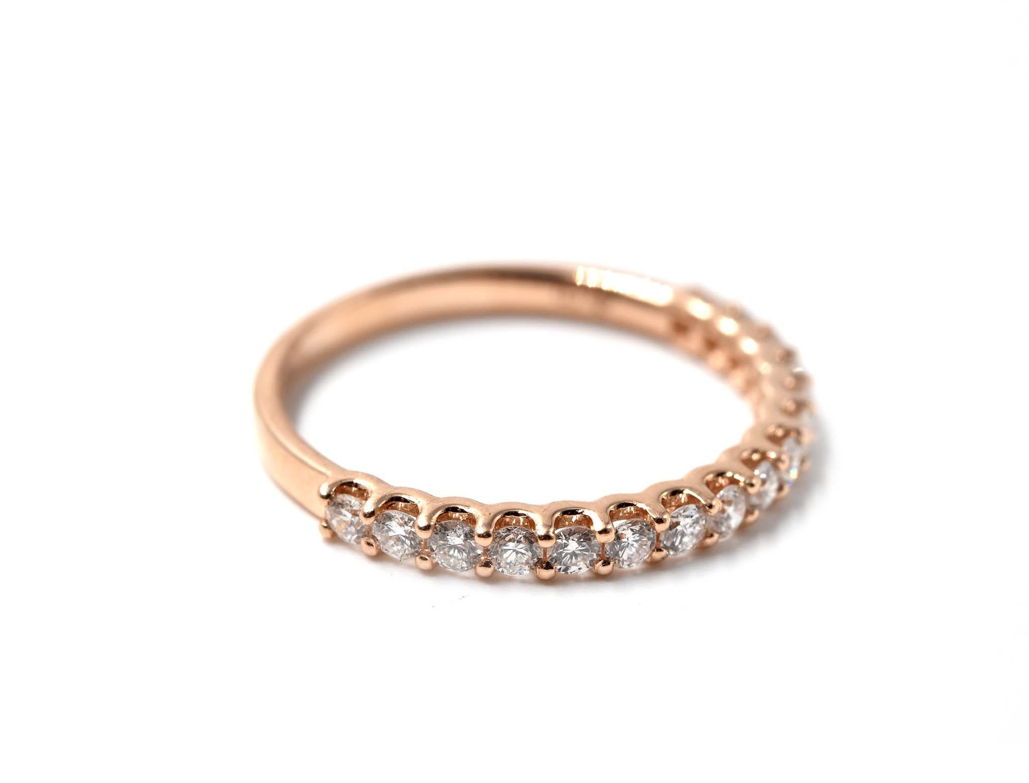 Designer: custom design
Material: 14k rose gold
Diamonds: 16 round brilliant cut diamonds = 0.37 carat total weight
Dimensions: band is 2.20mm wide
Ring size: 5 3/4 (please allow two additional shipping days for sizing requests)
Weight: 1.00 grams
