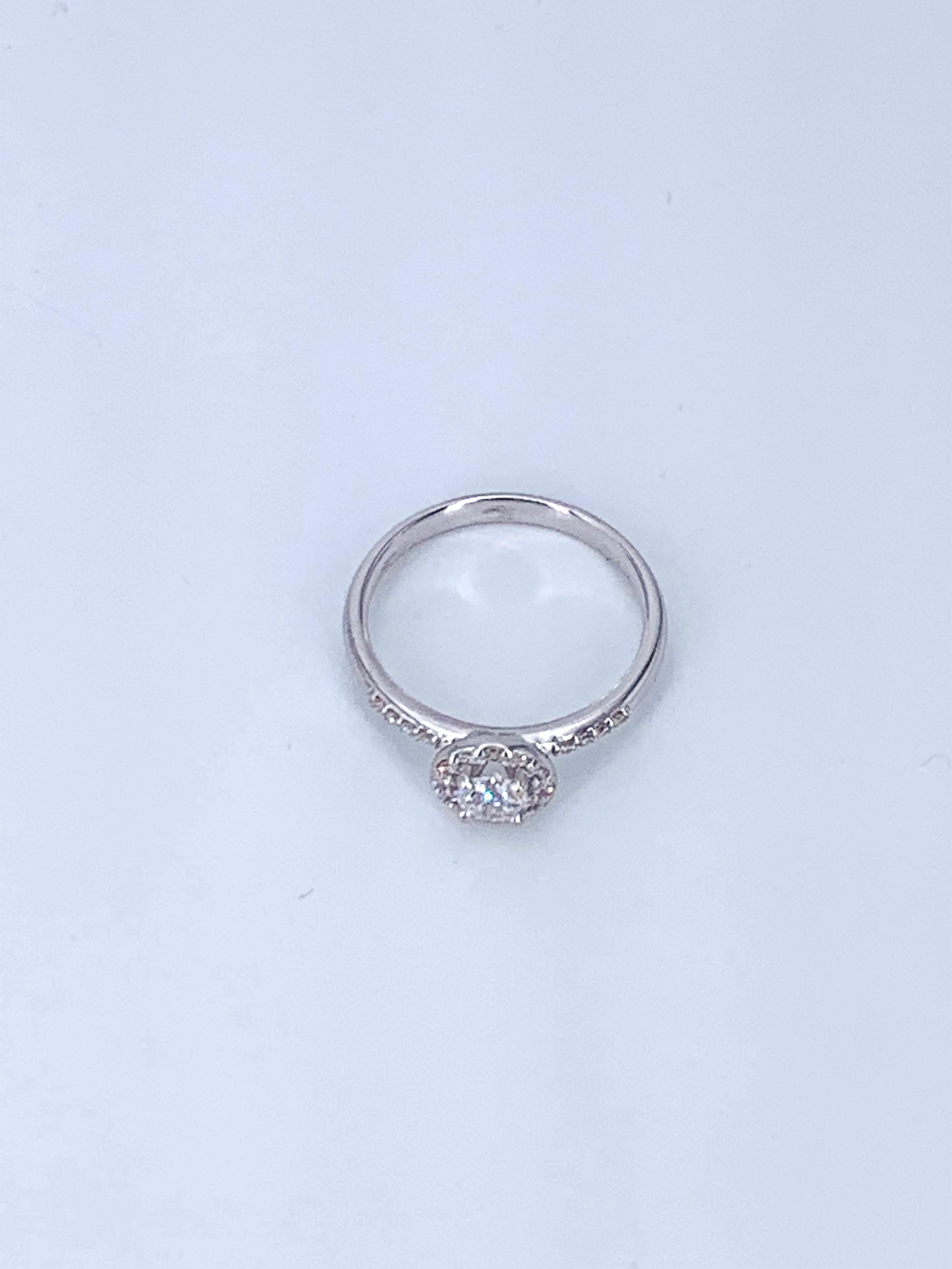This 0.37 carat half pave solitaire is from the Jennifer Collection, holds the centre Diamond in a halo setting and covers the face of the ring band in small Diamonds. Adding brilliance and beauty to any finger that wears it. 

Set in 18Kt white