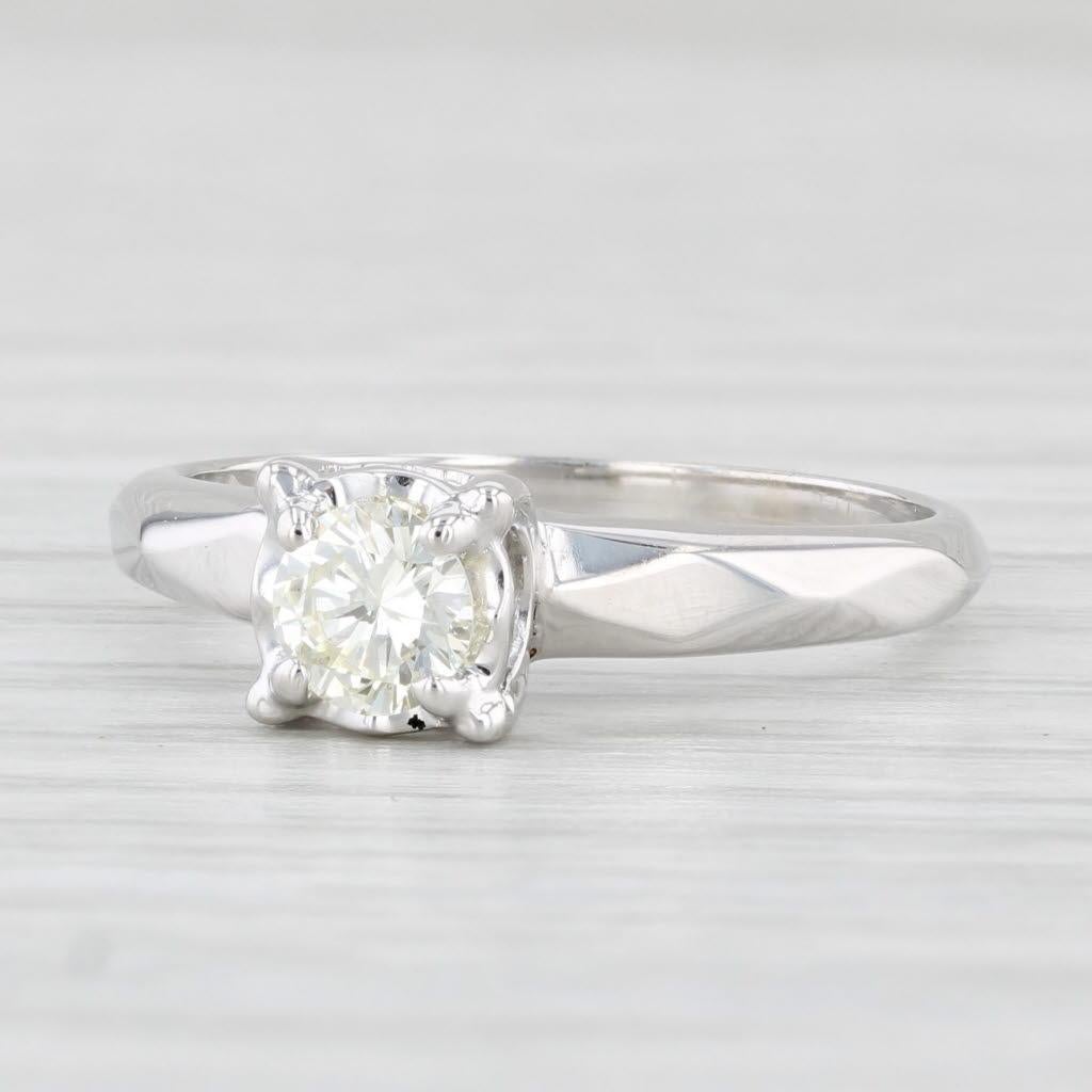 Gemstone Information:
- Natural Diamond -
Carats - 0.37ct 
Cut - Round Brilliant
Color - L - M
Clarity - VS2

Metal: 14k White Gold
Weight: 2.5 Grams 
Stamps: 14k Aria
Face Height: 5.8 mm 
Rise Above Finger: 6.7 mm
Band / Shank Width: 1.7 mm

This