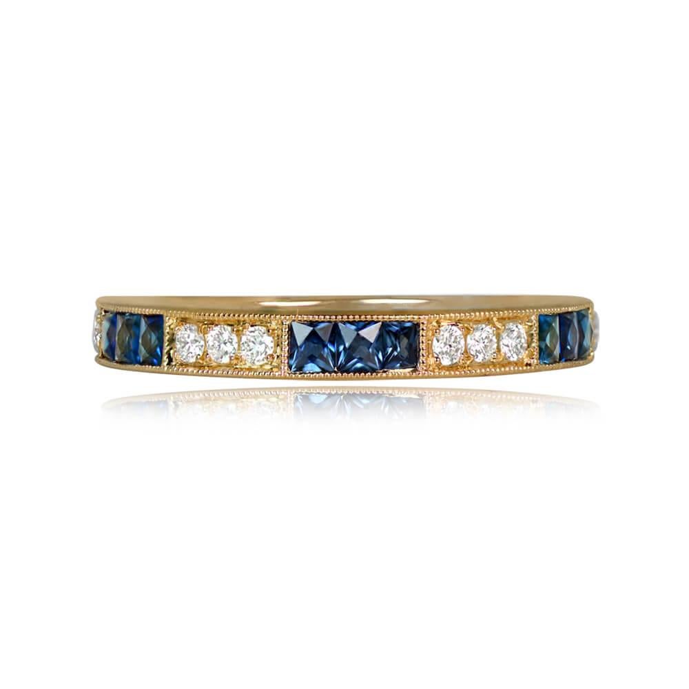 A chic 18k yellow gold half-eternity wedding band showcasing a delightful three-by-three pattern of French cut sapphires totaling 0.37 carats and round brilliant cut diamonds with a combined weight of 0.14 carats. The setting is elegantly bordered