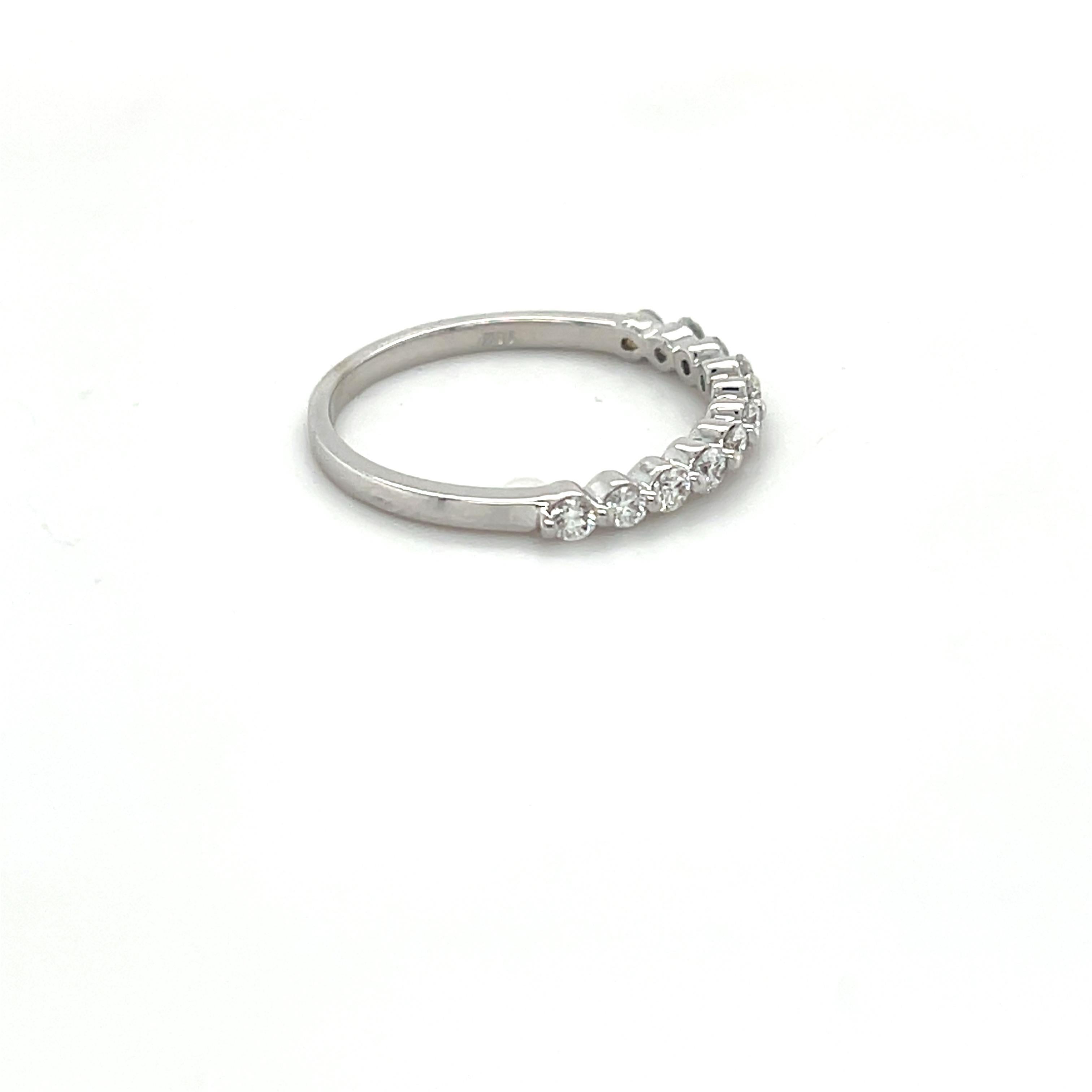 Stackable Diamond Band Ring by Roshe Jewels


Elegant and contemporary band ring.
Features round cut white diamonds with a total carat weight of 0.38. Diamonds are slightly included (SI1) with a color grade of F.
Crafted in 14k white gold, weighing