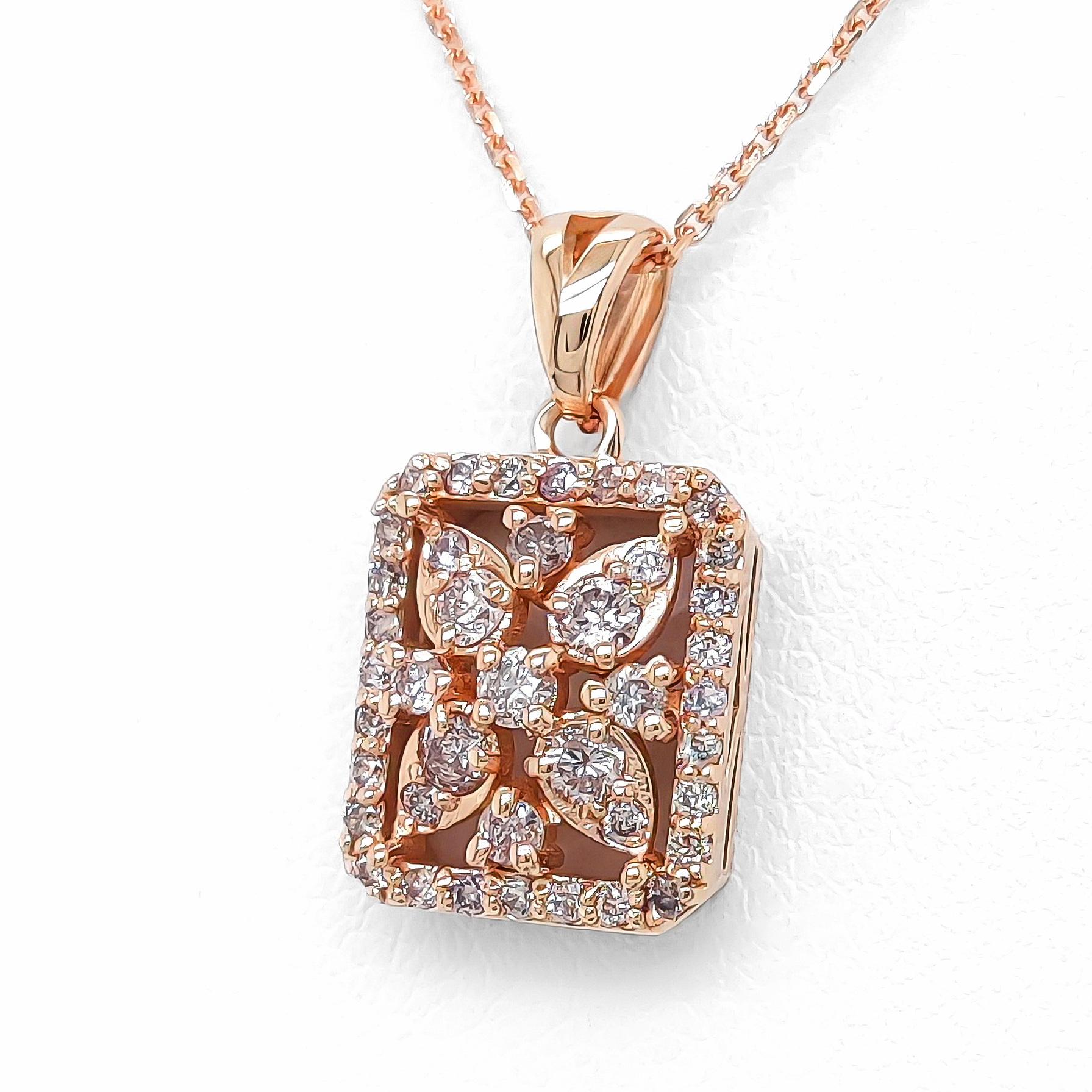 FOR CUSTOMERS FROM THE USA NO VAT

Elevate your style with this enchanting pendant featuring a captivating ensemble of 41 natural round brilliant diamonds. With a total weight of 0.38 carat, these mesmerizing light pink gems bring a touch of natural
