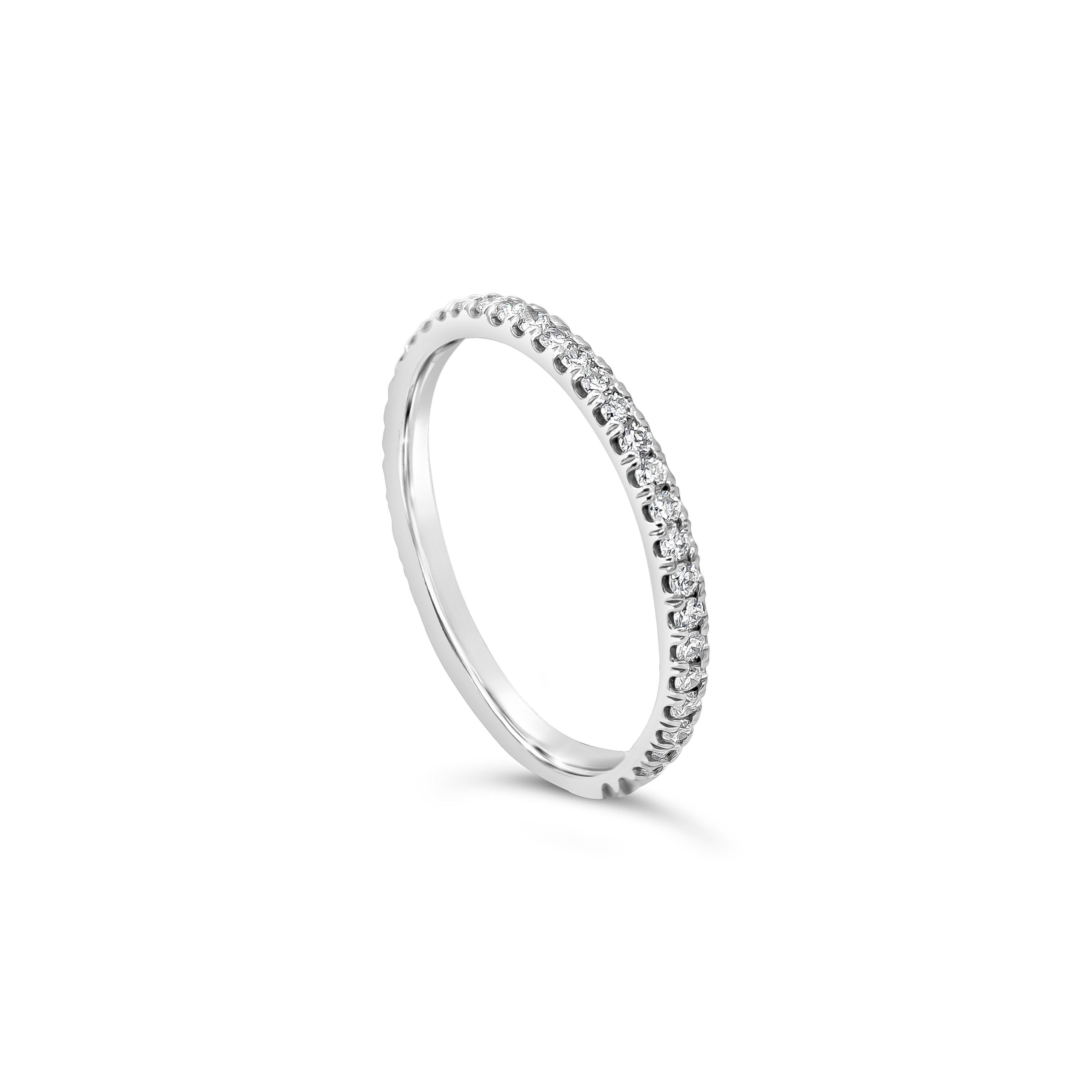 A classic eternity wedding band style showcasing a line of round brilliant diamonds weighing 0.38 carats. Set in a scalloped pave set and Made in 18K White Gold. Size 6 US resizable upon request.

Roman Malakov is a custom house, specializing in