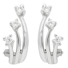 Boucles d
oreilles en or blanc 18k avec trois diamants de 0,38 carats