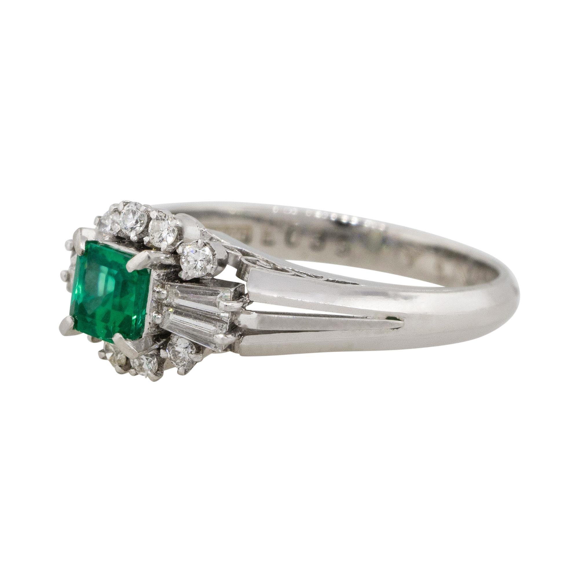 Material: Platinum
Gemstone details: Approx. 0.39ctw Emerald center gemstone
Diamond details: Approx. 0.27ctw of round and baguette cut Diamonds. Diamonds are G/H in color and VS in clarity
Ring Size: 4.5
Ring Measurements: 0.75