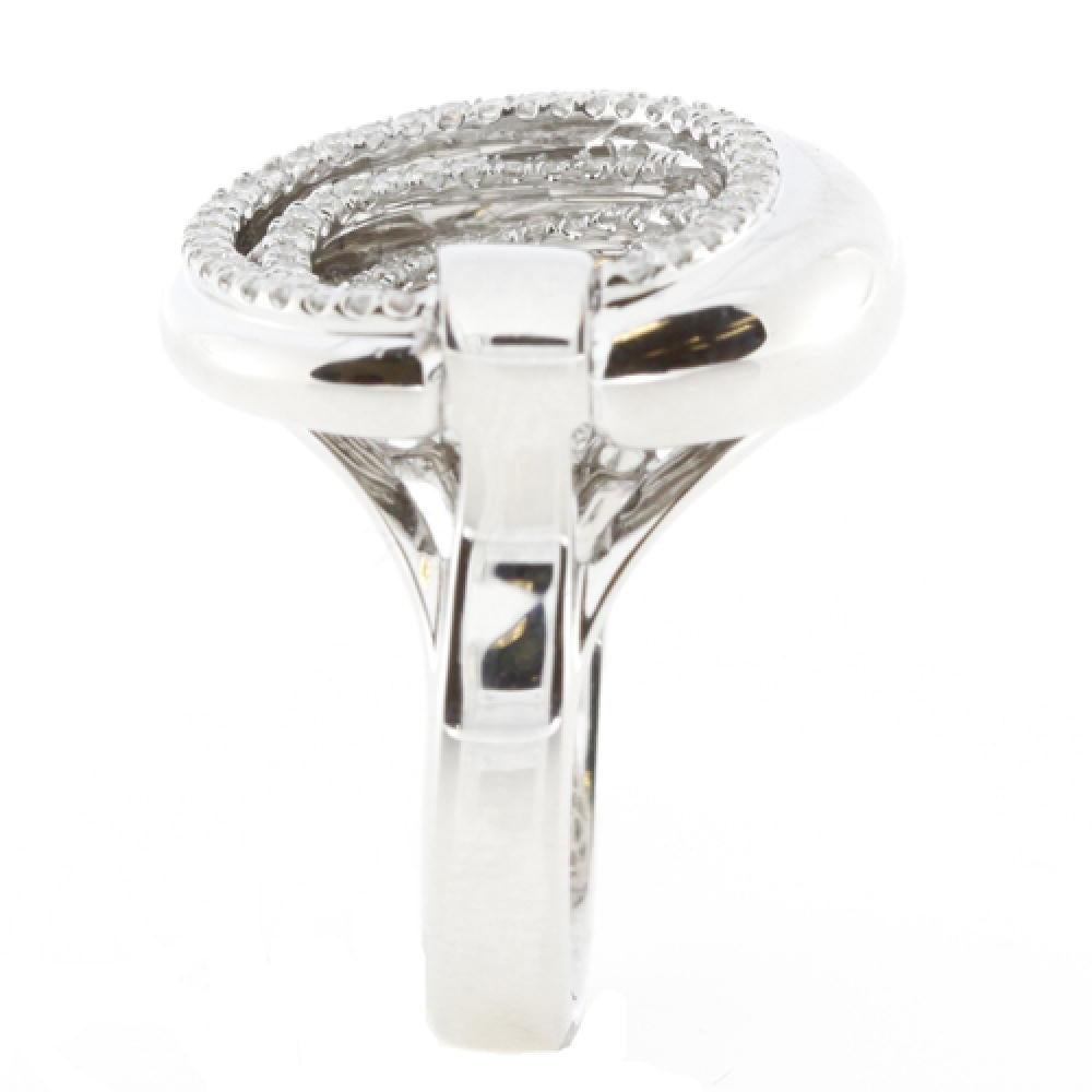 This 0.39 Carat White Diamond Circle Design Fashion Ring is set on stunning 18k white gold for a luxurious feel. In the center of the ring there is a stacked circle design made of white diamonds. The circles overlap each other, each circle growing