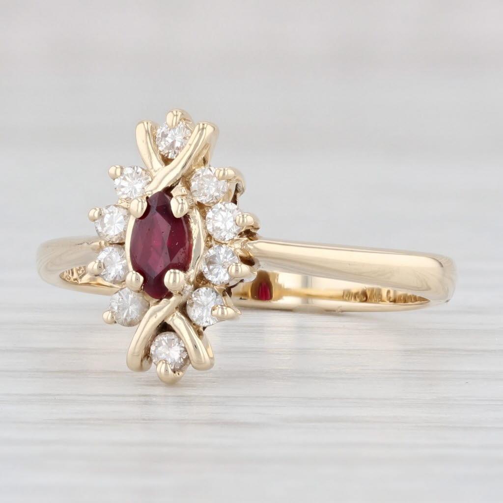 Gemstone Information:
- Natural Diamonds -
Total Carats - 0.20ctw
Cut - Round Brilliant
Color - G - I
Clarity - VS2

- Natural Ruby -
Carats - 0.19ct 
Cut - Marquise
Color - Red
Treatment - Routinely Enhanced

Metal: 14k Yellow Gold
Weight: 2.9