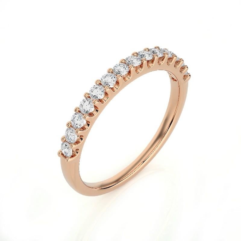 Diamonds: Fourteen meticulously selected round diamonds grace this wedding ring, each securely set in a classic prong setting. The total carat weight of 0.4 carats ensures a captivating and enduring sparkle.

Gold Setting: Crafted with precision in