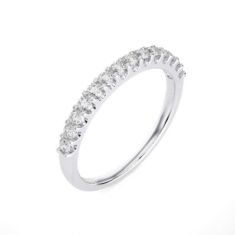 Diamonds: Fourteen meticulously selected round diamonds grace this wedding ring, each securely set in a classic prong setting. The total carat weight of 0.4 carats ensures a captivating and enduring sparkle.

Gold Setting: Crafted with precision in