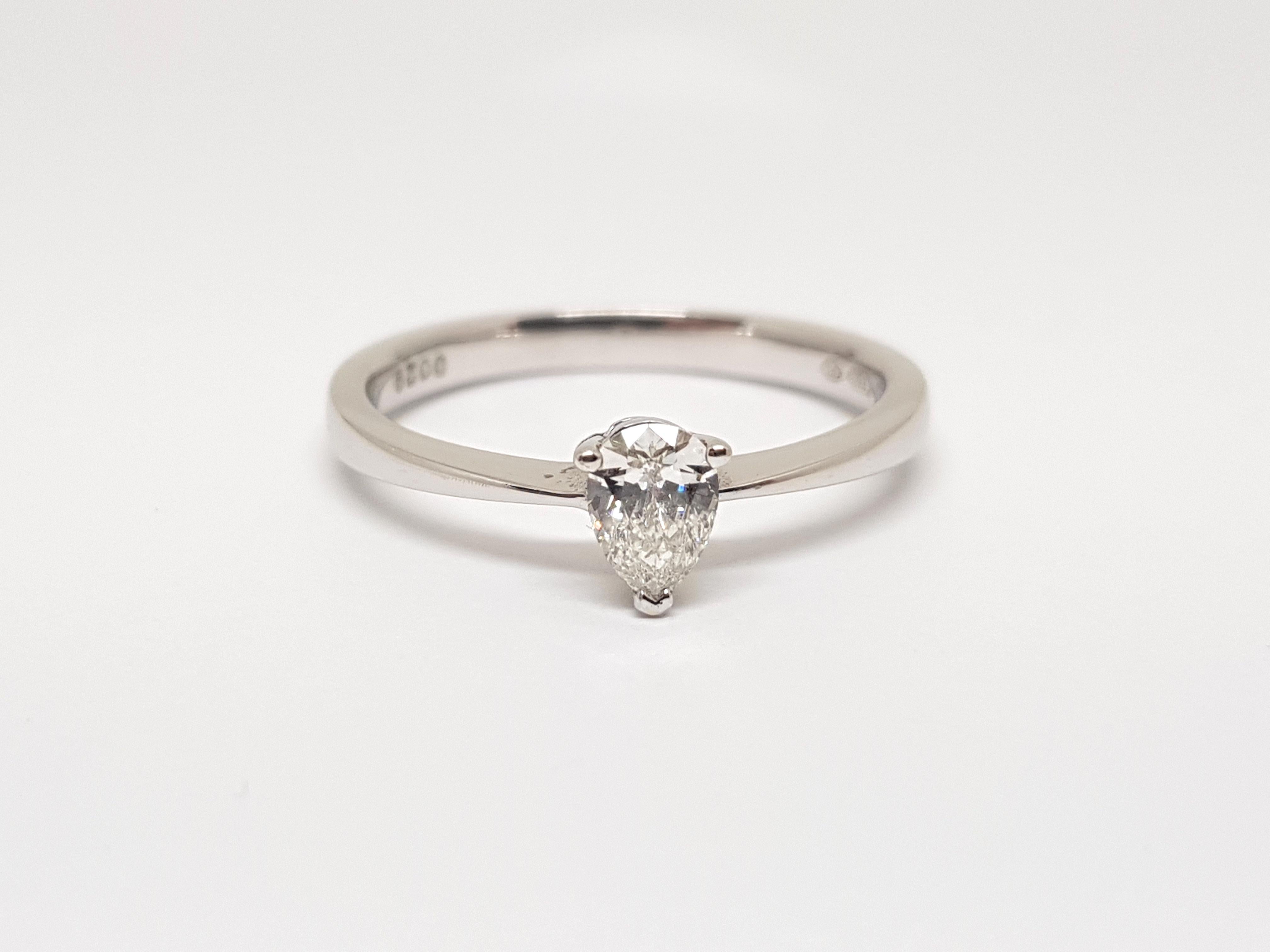 Gold: 18K White Gold. 
Weight: 2,50 gr. 
Diamonds: 0,40ct. F / VS Pear Shape 
Width: 0,6 cm 
Ringsize: 53 / 16,75mm 
Free resizing of ring up to size 70 / 22mm 
Shipping: free worldwide insured shipping 
All our jewellery comes with a certificate