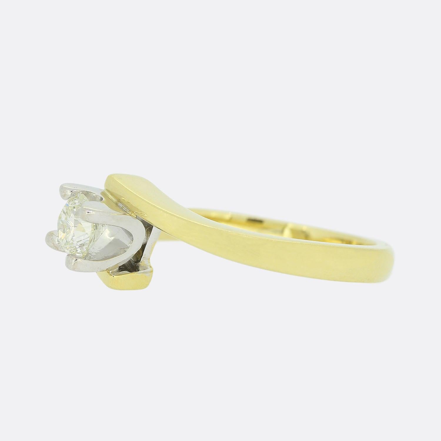 This is an 18ct yellow gold diamond solitaire ring. The central diamond is a brilliant cut which has been claw set in an 18ct yellow gold twist style mount.

Condition: Used (Very Good)
Weight: 6.0 grams
Size: O
Total Diamond Carat Weight: Approx.