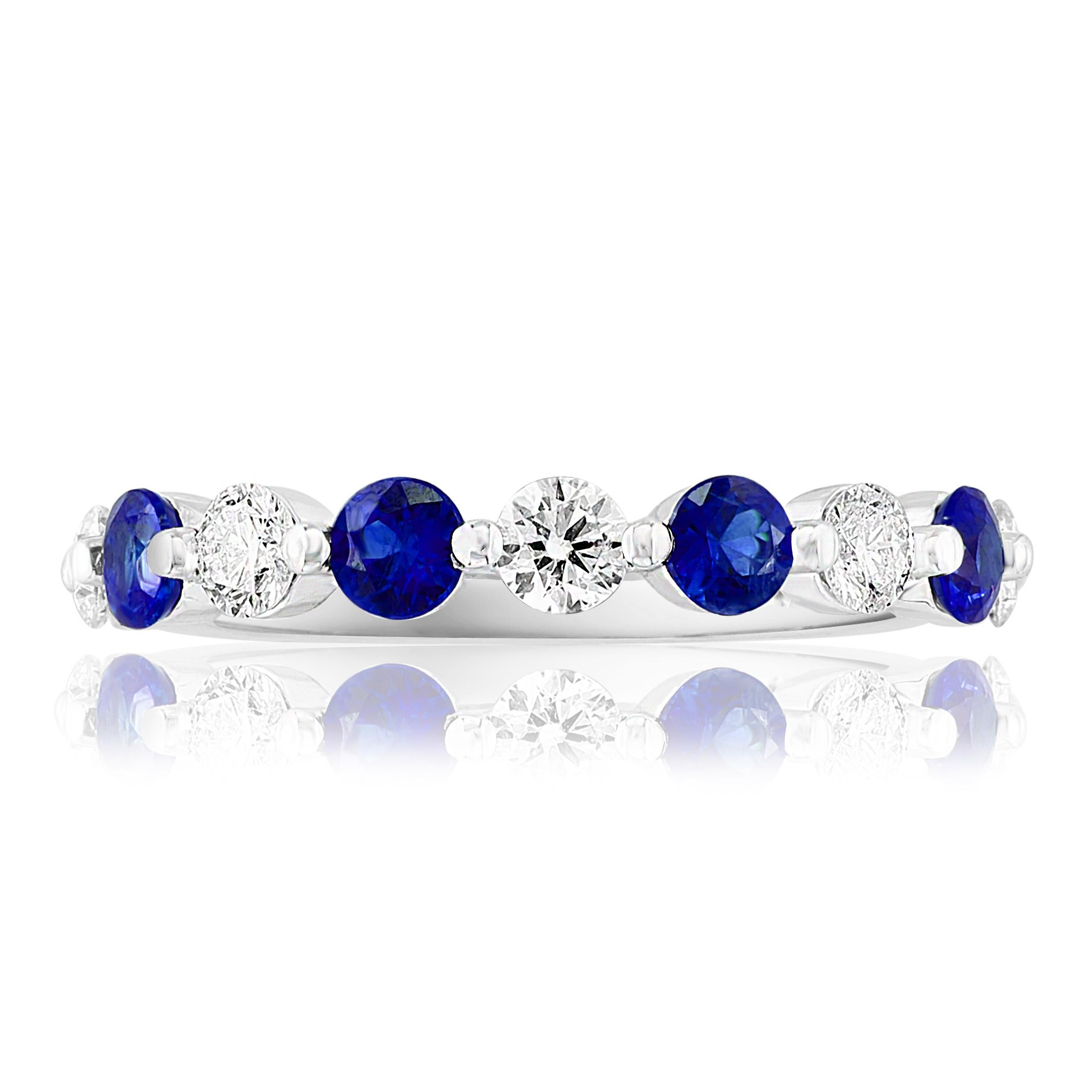 A fashionable and classic wedding band showcasing 5 brilliant cut diamonds weighing 0.50 carats total alternating with 4 round blue sapphires weighing 0.40 carats. Stones secured with a shared prong setting made with 14K white gold. A versatile