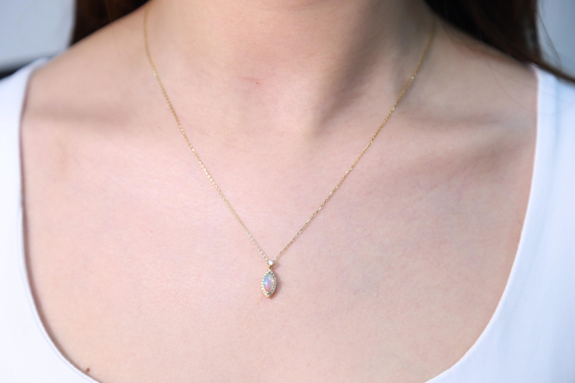 Decorate yourself in elegance with this Pendant is crafted from 10-karat Yellow Gold by Gin & Grace Pendant. This Pendant is made up of 4X8 Marquise-cut Prong setting Natural Opal (1 Pcs) 0.40 Carat and Round-Cut Prong setting Natural White Diamond