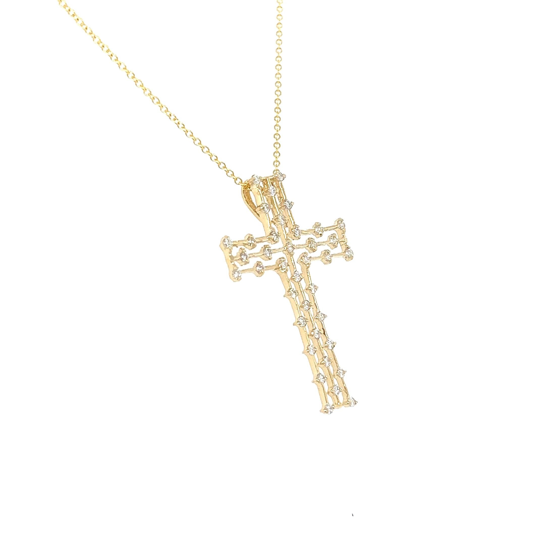 This beautiful cross pendant has 0.40 carats of Natural Round Cut Diamonds with a clarity and color of VS-H. 

The pendant and chain has an approximate weight of 3.0 grams and is curated in 14 Karat Yellow Gold. 

The length of the chain pendant is