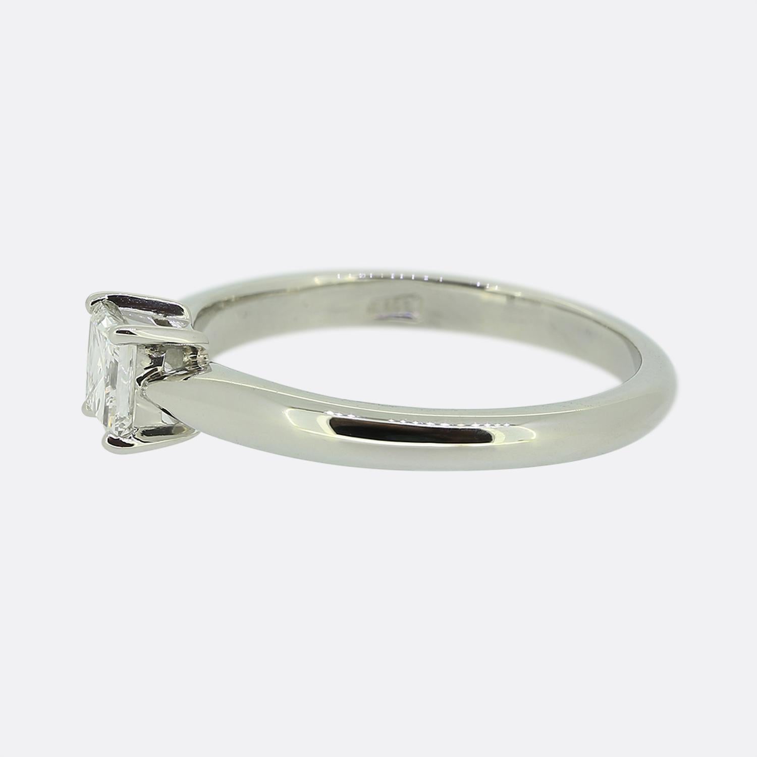 Here we have a charming diamond engagement ring. Focally at the centre of the face we find a single 0.40 carat princess cut diamond possessing a stunning colour and clarity. The ring is made complete by a plain polished platinum band. 

Condition: