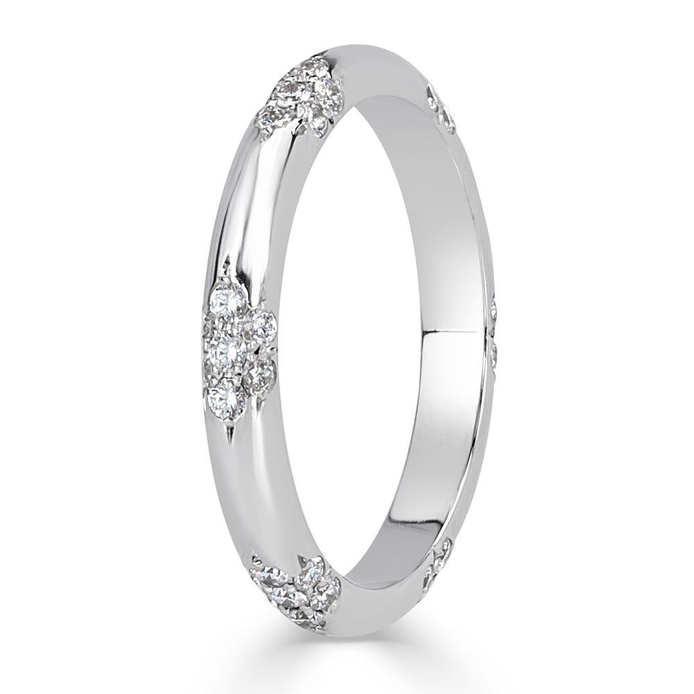 Handcrafted in high polish platinum, this exquisite diamond wedding band features 0.40ct of round brilliant cut diamonds set in a whimsical floral pattern. The diamonds are graded at E-F, VS1-VS2. All eternity bands are shown in a size 6.5. We