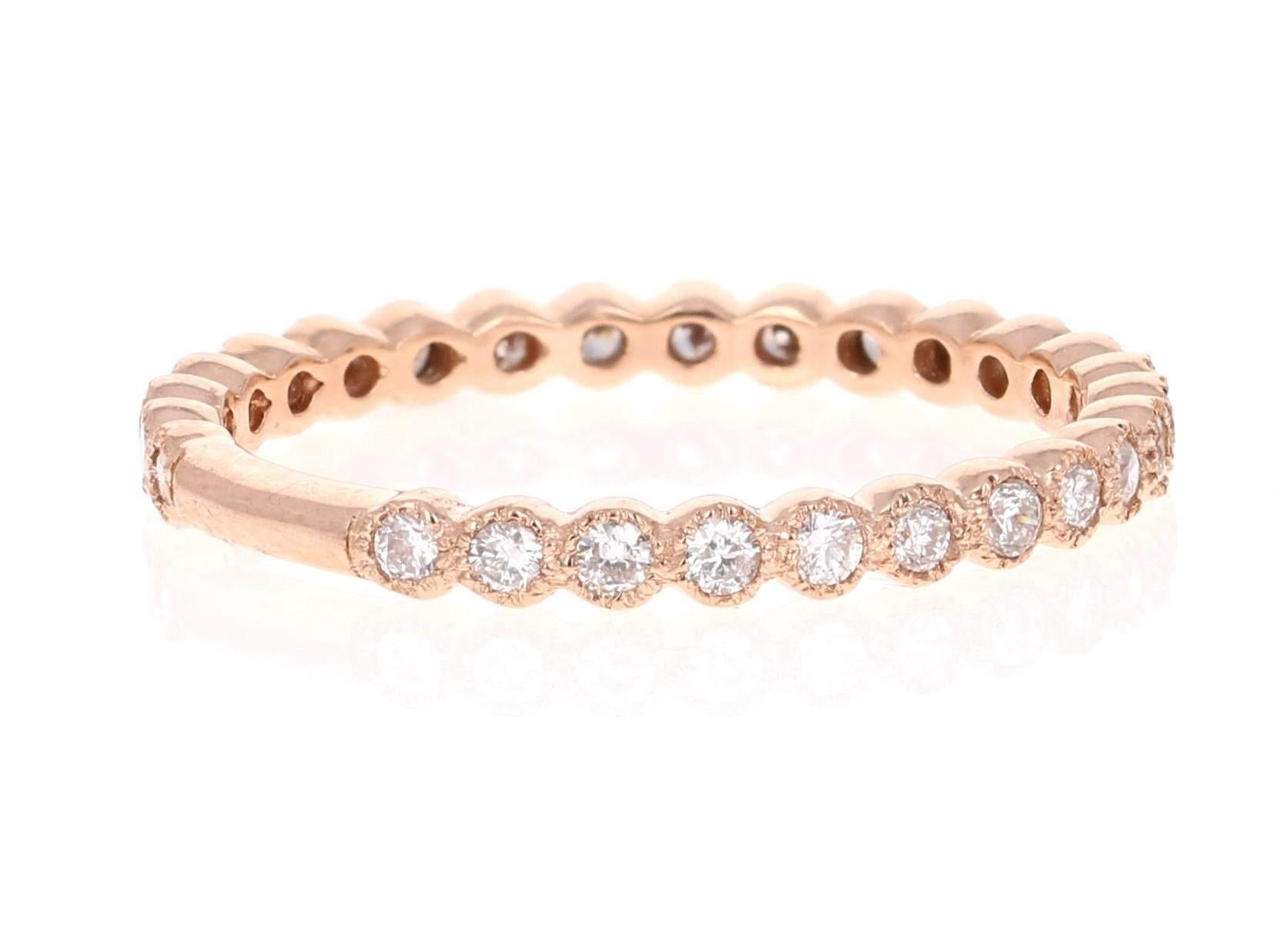 Cute and dainty 0.40 Carat Diamond band that is sure to be a great addition to anyone's accessory collection. There are 27 Round Cut Diamonds that weigh 0.40 carats. The total carat weight of the band is 0.40 carats. The band is made in 14K Rose