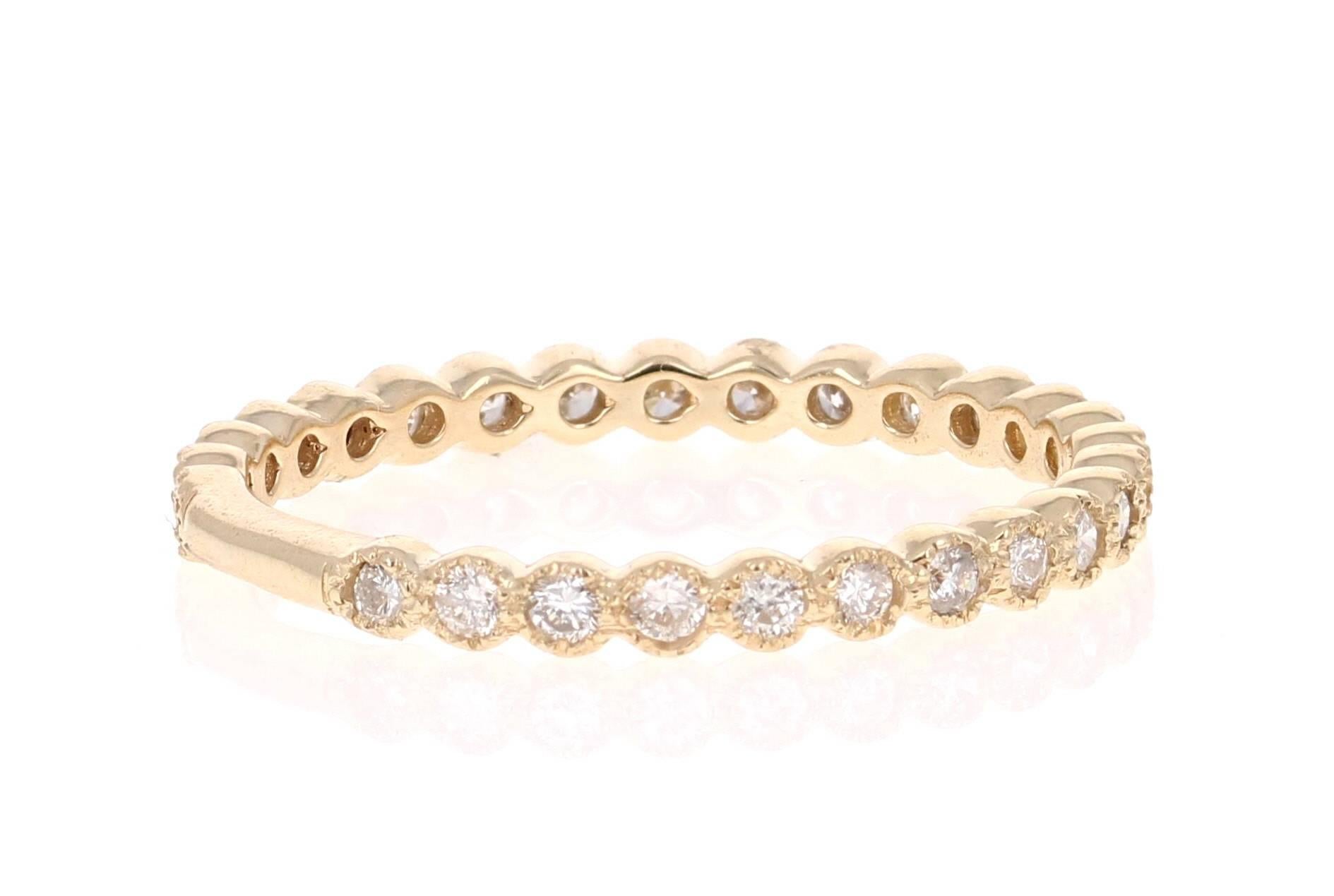 Cute and dainty 0.40 Carat Diamond band that is sure to be a great addition to anyone's accessory collection. There are 27 Round Cut Diamonds that weigh 0.40 carats. The total carat weight of the band is 0.40 carats. The band is made in 14K Yellow