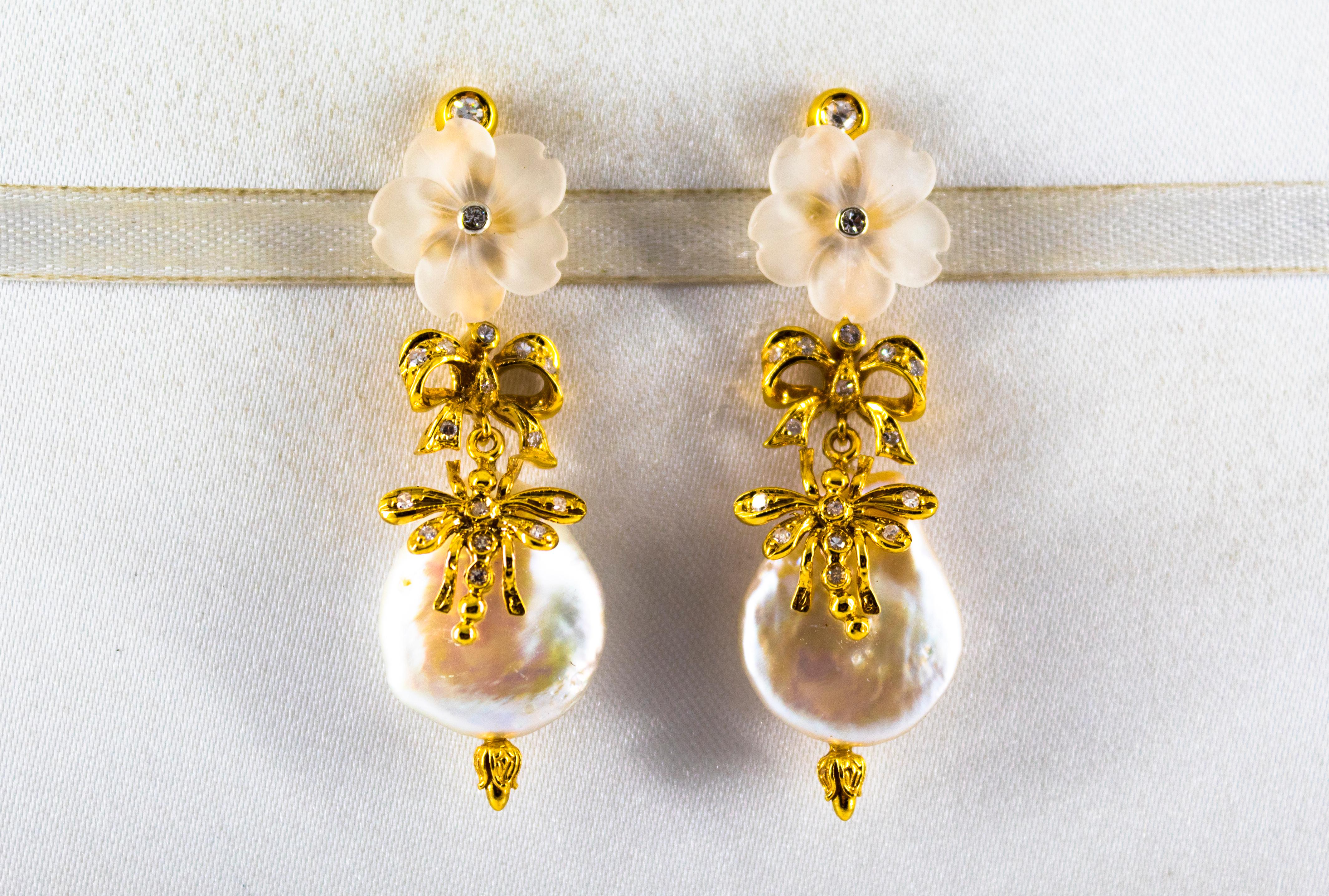 These Stud Earrings are made of 14K Yellow Gold.
These Earrings have 0.40 Carats of White Diamonds.
These Earrings have also Pearls and Rock Crystal.
These Earrings are available also with Green Flowers made of Agate or Purple Flowers made of