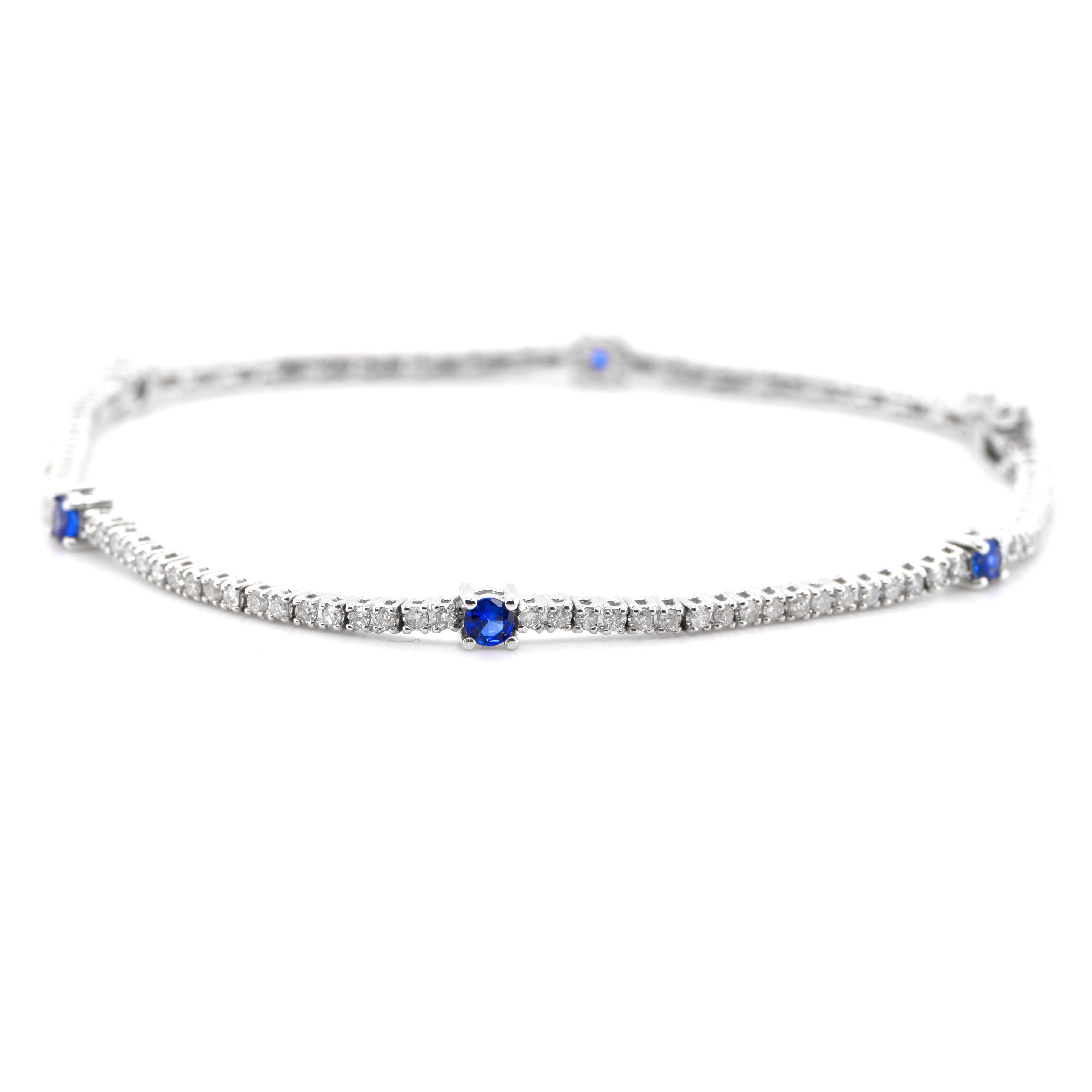 A beautiful Tennis Bracelet featuring a total of 0.40 Carats of Natural Sapphires and 0.95 Carats of Diamond Accents set in 18 Karat White Gold. The Sapphires are of 4x3mm size. Sapphires have extraordinary durability - they excel in hardness as