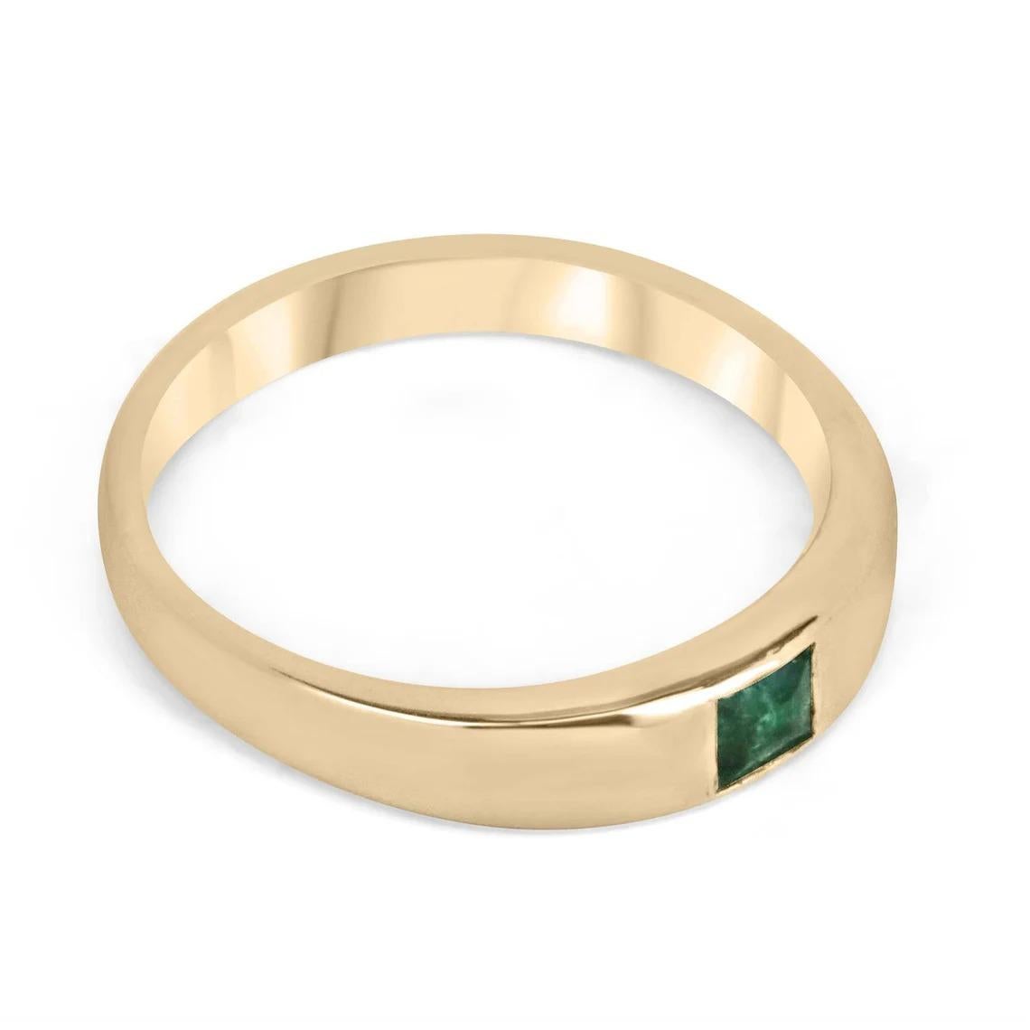 Introducing a striking solitaire emerald ring that effortlessly blends boldness and elegance. This captivating piece features a 0.40 carat princess cut emerald with a vivid dark green color that commands attention. The emerald's excellent luster