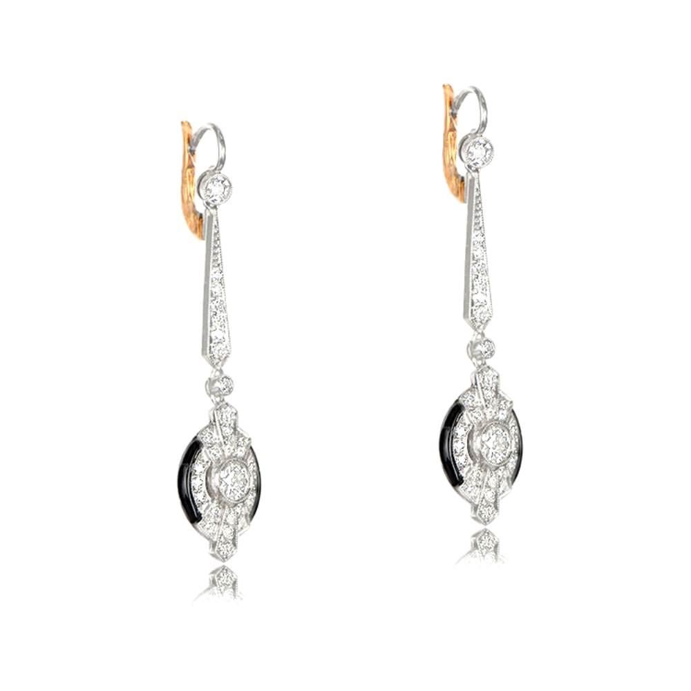 Elevate your style with this exquisite pair of Art Deco-inspired earrings, meticulously hand-crafted in platinum. The focal point of the earrings is the bottom section, featuring captivating old European cut diamonds with approximate weights of 0.40