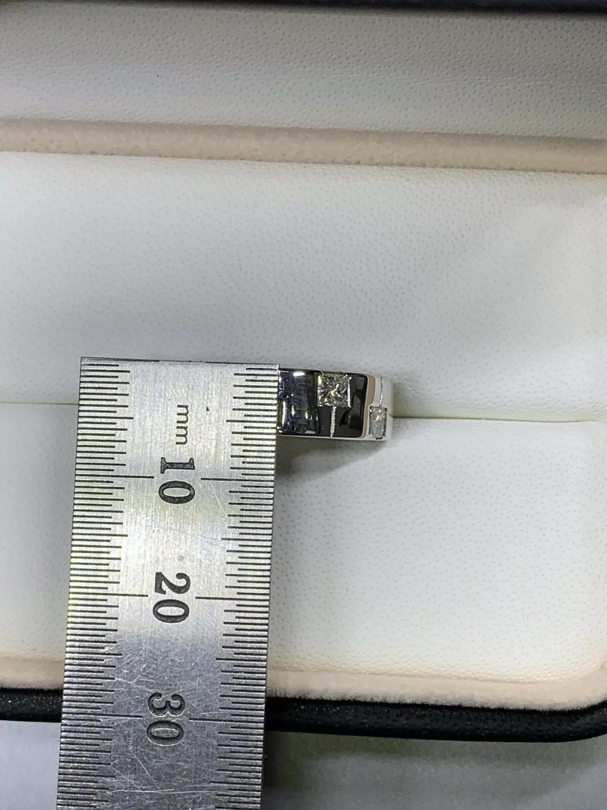 This beautiful ring features a stunning 0.40ct F/G VS1 princess diamond set in a chunky engagement band. Crafted with fine jewellery materials, this ring is perfect for any special occasion. The platinum band adds a touch of luxury to the piece,