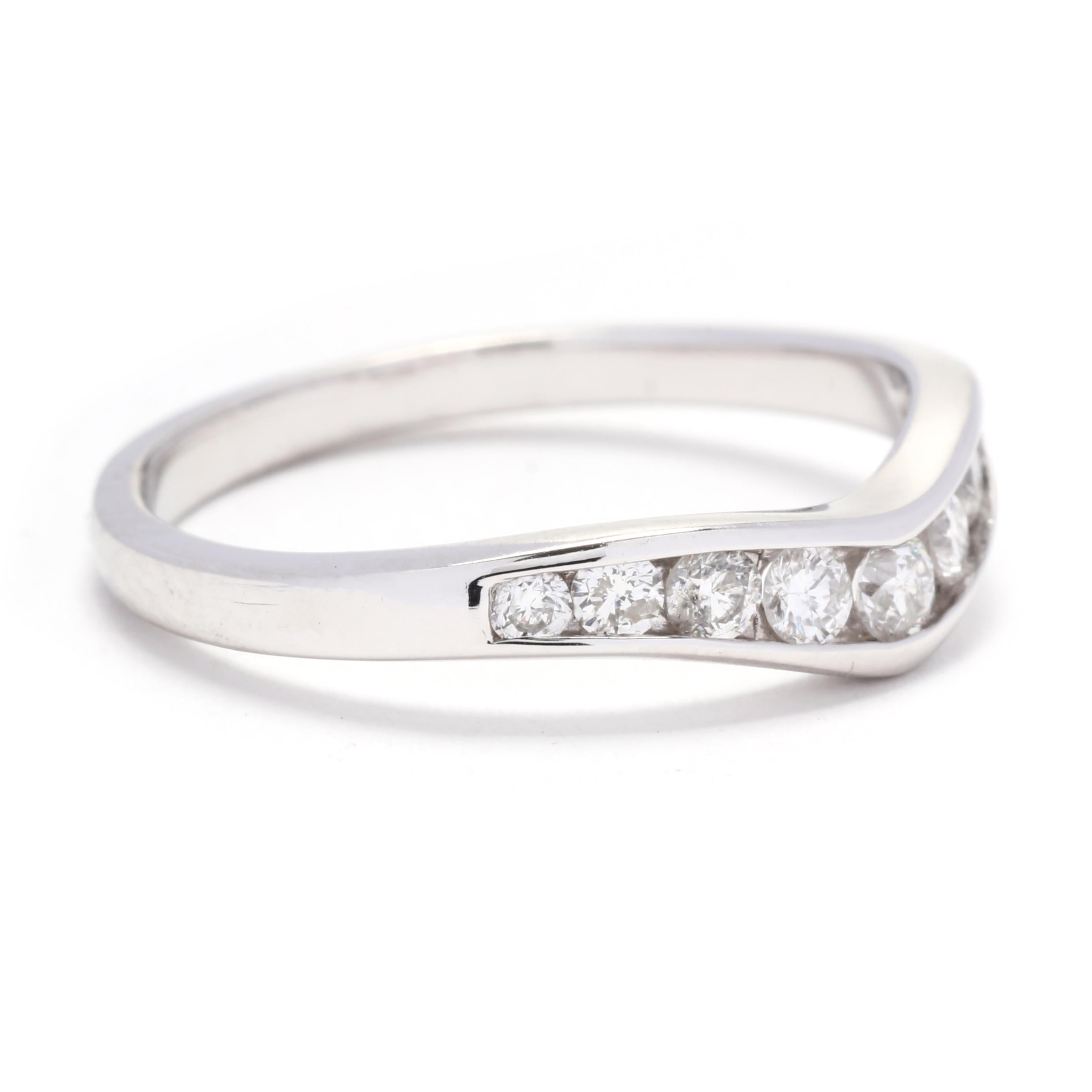 This 0.40ctw curved diamond wedding band is a stunning and unique choice for your special day. Made in 14K white gold, it features a gentle curve that perfectly nestles against your engagement ring or can be worn on its own for a minimalist look.