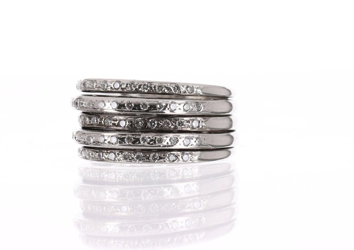 This a fine, five-row diamond lady's fashion band in solid 14K white gold. Five layers of diamonds and gold make this ring one of a kind. The diamonds are bezel set to perfection and have a near-colorless hue of H-I, VS clarity. Each row is slightly