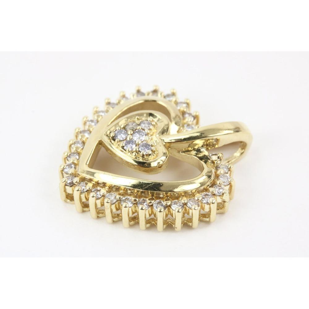 This exciting diamond heart pendant is a romantic symbol of your love. Crafted in 14k yellow gold, this open design features round diamonds that shimmer all around. Radiant with 0.40cts of diamonds and a brilliant buffed luster. This beauty is ideal