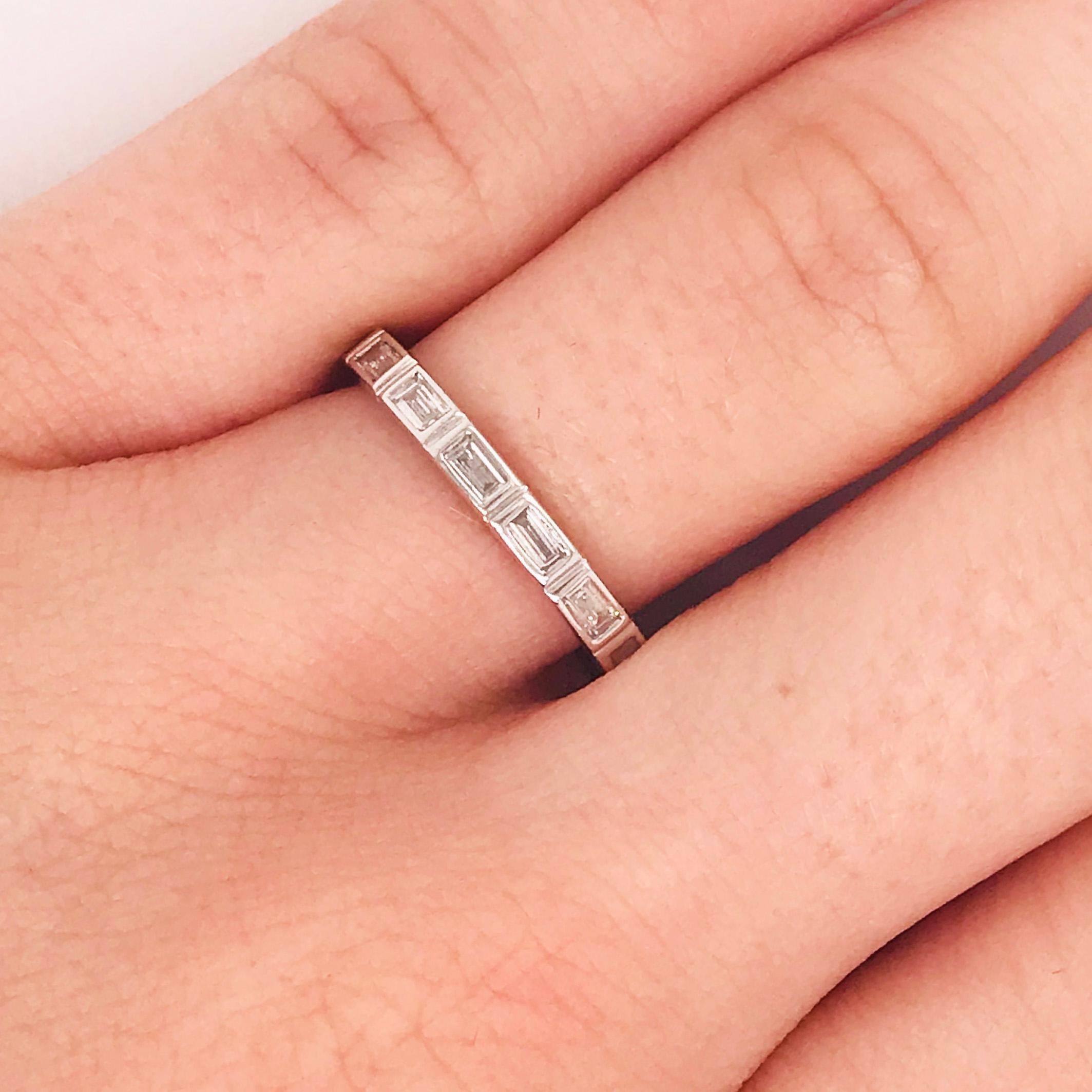 This modern diamond baguette band is a clean, sleek design. With natural baguette diamonds set East to West in bezel settings. This band has a seamless, bright white look! The diamonds are G-H color and VS-1 Clarity, very clear and very white! The