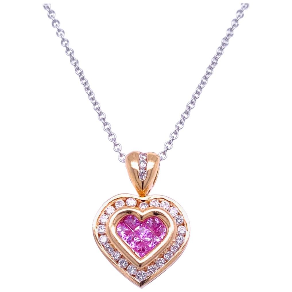 18K Gold Heart shaped Pendant with 8 Invisible Set Princess Cut Pink Sapphires (Total Gem Weight 0.41 Ct) surrounded by a Channel set Halo of diamonds and Diamond Bale with total weight of 0.41 Ct. 
Total Diamond Weight: 0.41 Ct
Total Gem Weight: