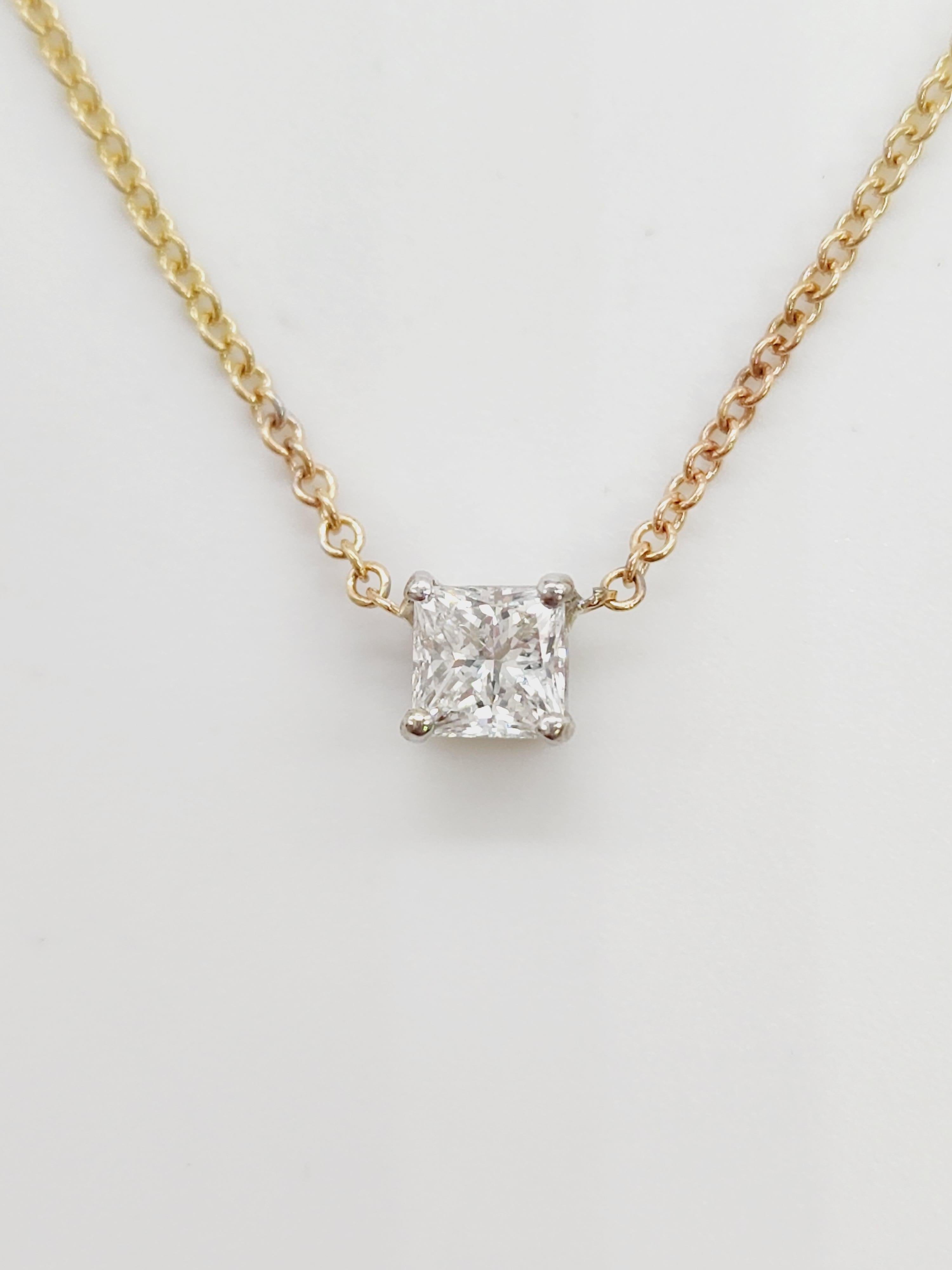 0.41 Natural Princess shape diamond pendant. set in 14k yellow gold. 4 prong set, chain measures 18 inch.
