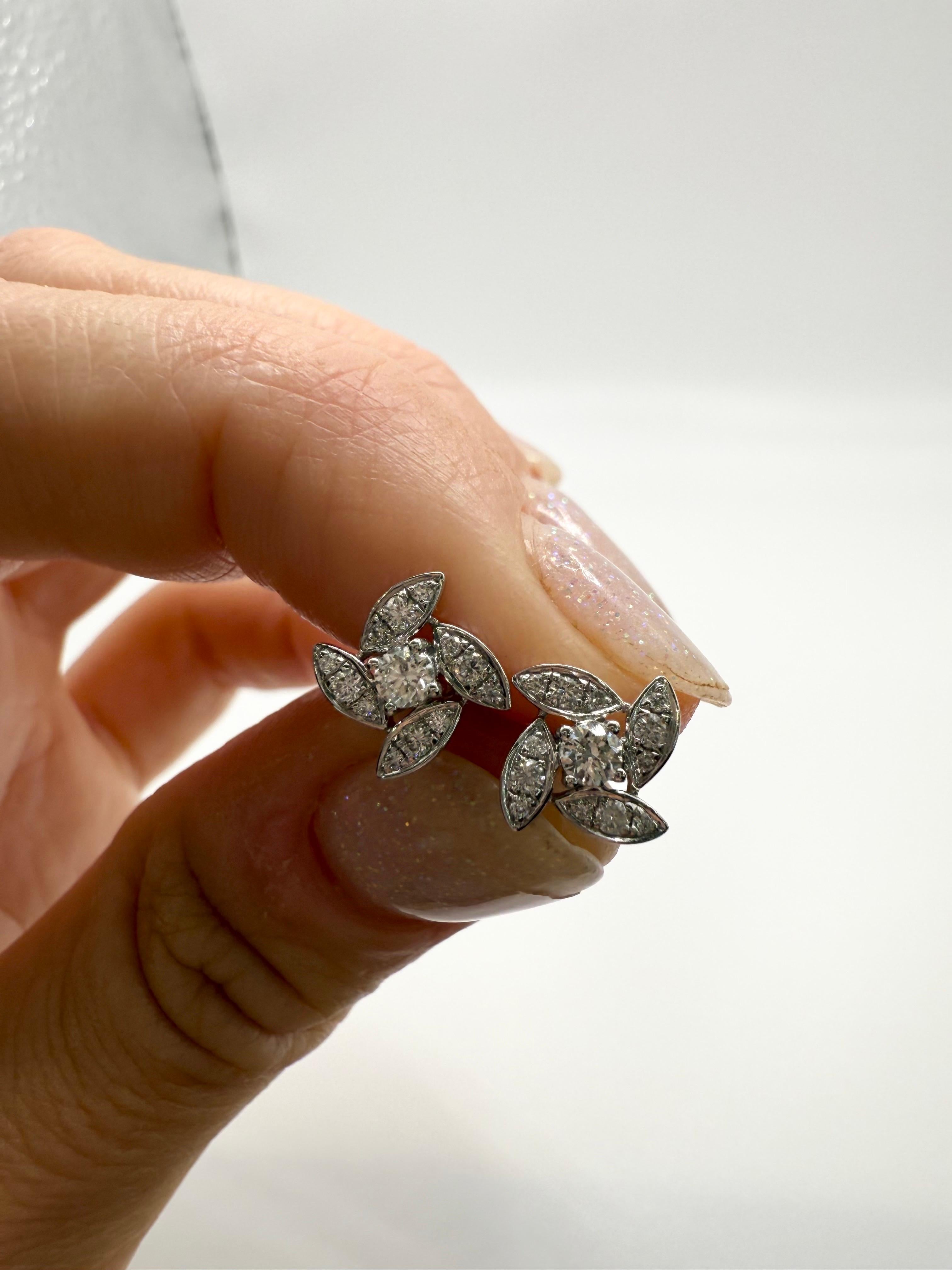 Cute Floral Earrings in 18KT gold made with natural diamonds VS-SI clarity and G color totaling 0.41 carats.


**All items leave our premises with a certificate in buyers name, company policy! This insures security for you and us, it is also