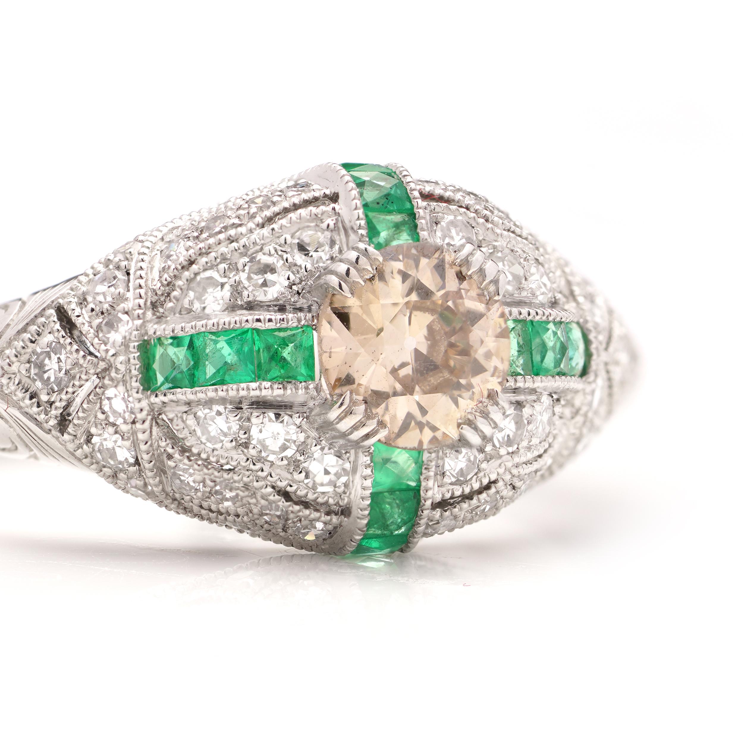 Platinum Art Deco-inspired 0.41 carats of fancy Champagne Colour Old -European cut dome ring surrounded by round brilliant diamonds and square-cut emeralds. 

Made in After 2000
Maker: JoAq 
X-Ray tested positive for .850 platinum purity.