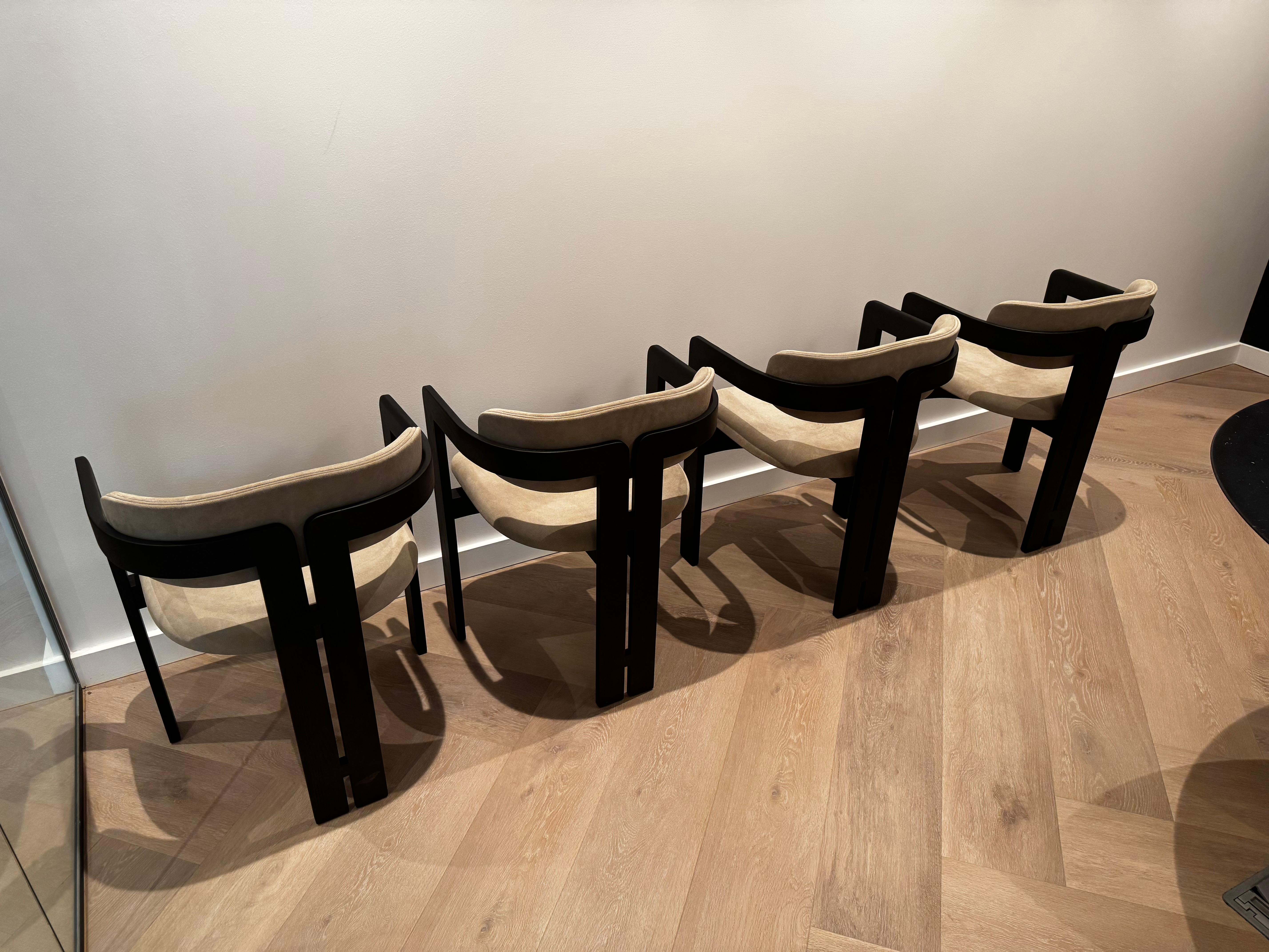 0414 Dining Chair
Designed by Studio G&R

Armchair with black stained open pore solid curved ash structure. Seat and backrest with internal structure in wood and by-products with padding in non-deformable foam polyurethane in different densities.