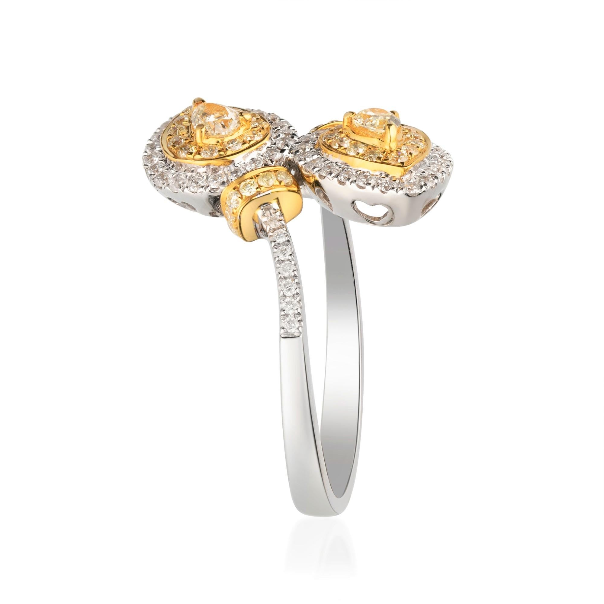 This beautiful Ring is crafted in 18-karat Two tone Gold and features an 2 Pcs  0.42 Carat Pear Cut Fancy Yellow Diamond surrounded with  36 Pcs Fancy Yellow Diamonds 0.23 Carats and 58 Pcs Round -cut White Diamonds 0.35 Carat in GH-SI quality.  It