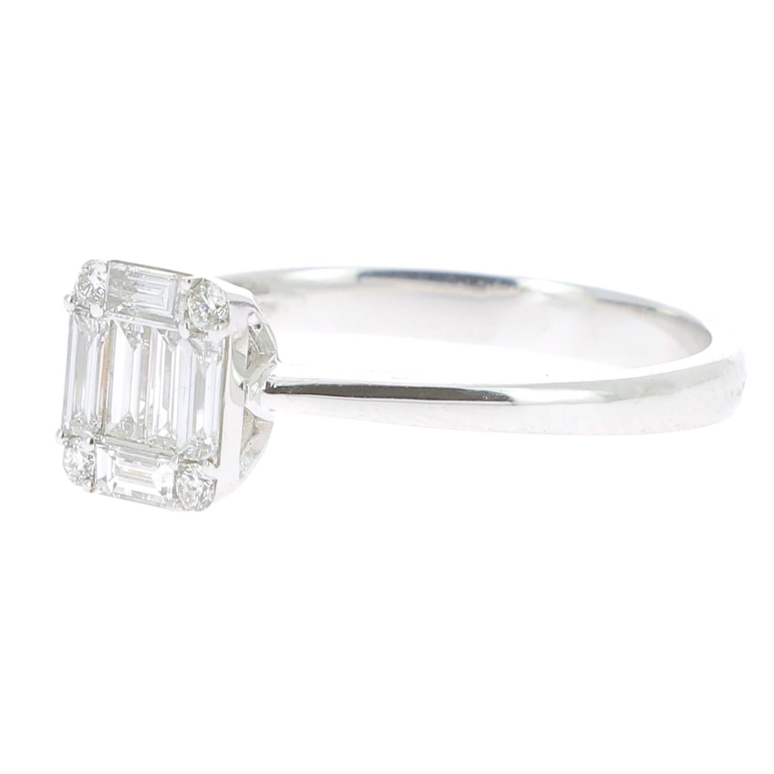 An unique Illusion Diamonds Ring set with Round Diamonds and Baguettes Diamonds giving the impression of One Emerald Cut Diamond.
The ring is set with 6 Baguettes Diamonds weighing 0.36 Carat, 4 Round Diamonds weighing 0.06 Carat 
Totaly the Diamond